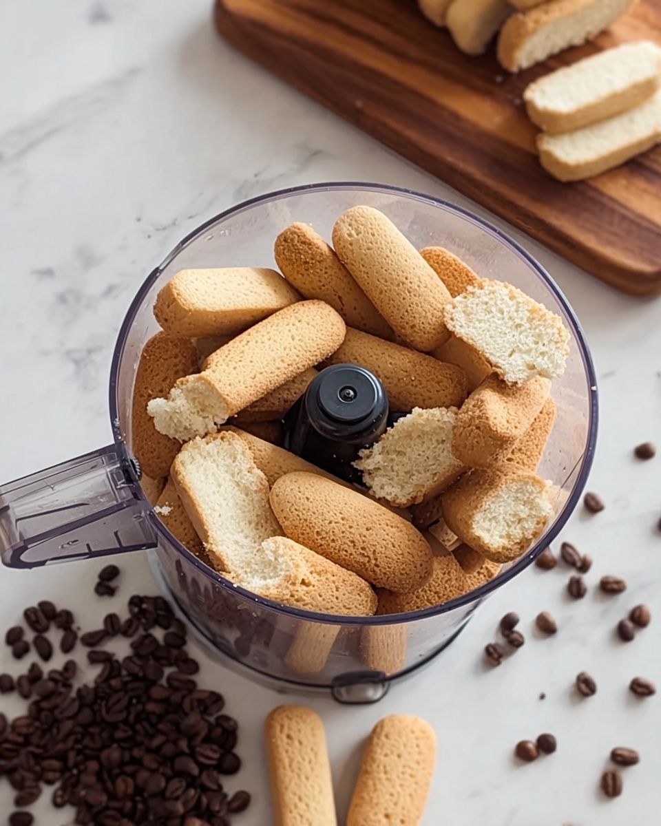 A clear glass bowl sits on a white marbled surface, filled with a smooth, thick, light beige cream being mixed by a woman's hand holding a metal whisk. In the background, a white bowl with light brown powder and a small white dish holding long, light tan biscuit sticks rest on a dark wooden board, with some dark coffee beans scattered around. The colors in the scene are soft and neutral, focusing on the light beige cream and the natural colors of the ingredients. Photo taken with an iphone --ar 4:5 --v 7