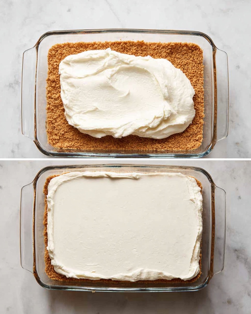The image shows a two-step process of making a layered dessert in a rectangular glass dish on a white marbled surface. The dish has two layers: the first layer is a crumbly golden-brown crust evenly spread at the bottom, and the second layer is a thick dollop of smooth, white cream placed on top, ready to be spread. In the next step, the white cream is spread evenly across the full surface of the brown crust, forming a smooth and even top layer. Photo taken with an iphone --ar 4:5 --v 7