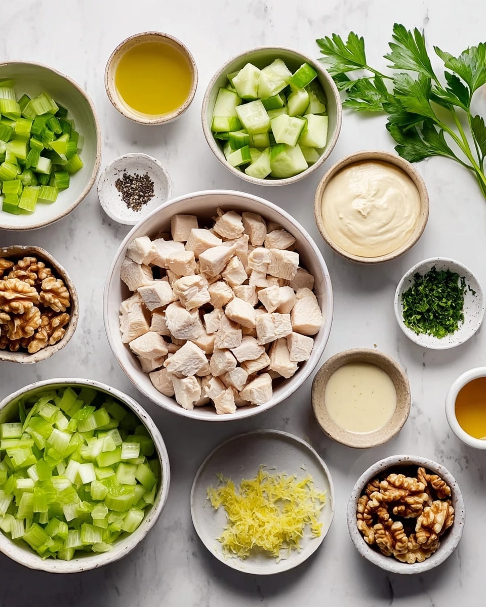 A clear glass bowl sits on a white marbled surface, filled with neatly arranged ingredients in separate sections. On one side, there are bright green celery pieces with a crisp texture, next to light green apple chunks with smooth edges. In the middle, there are rich brown walnuts with rough, uneven surfaces. Beside the walnuts, there is a pile of finely chopped dark green herbs. The last section shows white, cubed cooked chicken with a firm texture. Each ingredient is distinct and vibrant, creating a colorful and fresh visual mix. Photo taken with an iphone --ar 4:5 --v 7