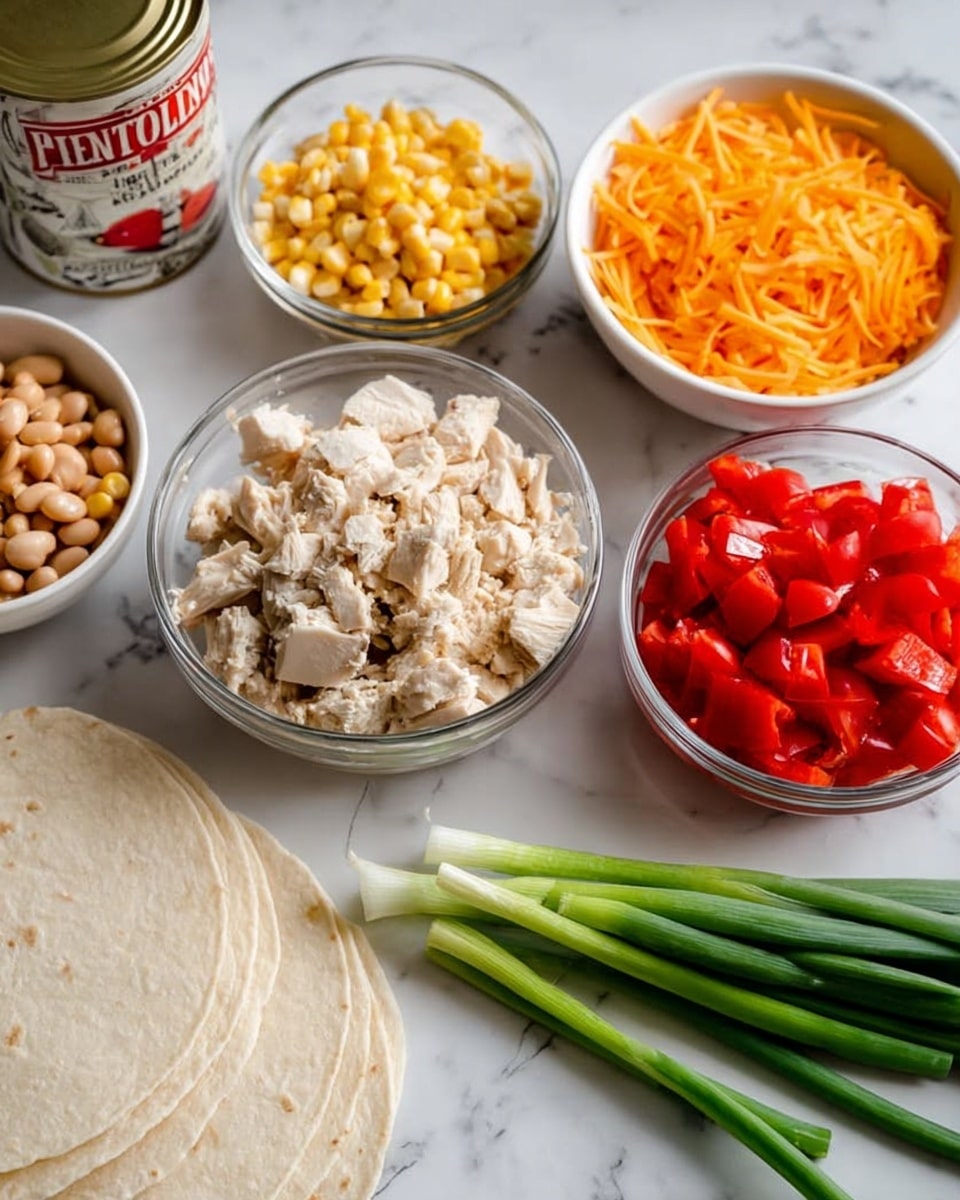 The image shows several clear and white bowls arranged on a white marbled surface. One clear glass bowl is filled with chopped cooked chicken, showing small white and light brown pieces. Next to it, another clear glass bowl holds shredded bright orange cheddar cheese. A white bowl contains diced red tomatoes with a juicy texture. There is also a smaller clear bowl filled with pale yellow corn kernels. Nearby, a stack of white tortillas rests flat on the surface. Green onions with bright green tops and white bottoms lie in front of the bowls. In the background, there is a can of pinto beans with a white label and red and black text. The scene is well-lit, with all items clearly visible and arranged neatly. Photo taken with an iphone --ar 4:5 --v 7