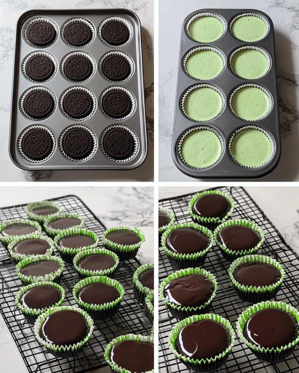 The image shows a small, round dessert with three clear layers. The bottom layer is a thin, dark chocolate cookie crust. The middle layer is thick, light green with small dark cookie pieces mixed inside, having a soft and creamy texture. The top layer is a smooth, shiny dark chocolate coating with slightly ruffled edges around the side. The dessert sits on a white marbled surface. In the background, there are more of the same desserts in white cupcake liners, blurred out, along with some green and black sandwich cookies and scattered small dark chocolate chips near the front. photo taken with an iphone --ar 4:5 --v 7