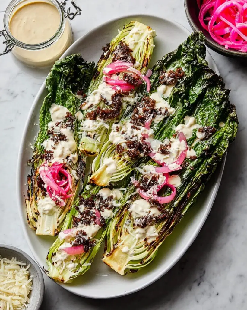 Grilled Romaine Caesar with Pickled Onions, Parmesan, and Homemade Croutons Recipe