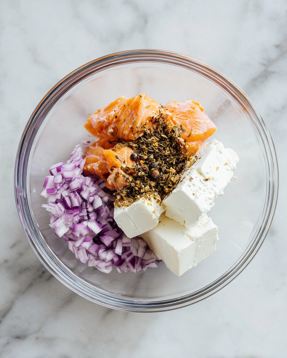 The image shows a round cheese ball that is half eaten, revealing a creamy orange inside with a soft texture. The outside is covered with chopped nuts and green herbs, giving it a rough and colorful look with shades of brown and green. It is placed on a white plate surrounded by square light brown crackers arranged neatly around the cheese ball. In front of the plate, there is a small spreader knife with a wooden handle resting on the white marbled surface, with some cheese on its blade. A white cloth is softly placed on the lower right of the frame, and in the background, there is a blurred white bowl. The whole scene sits on a white marbled surface, with soft natural lighting enhancing the textures. Photo taken with an iphone --ar 4:5 --v 7