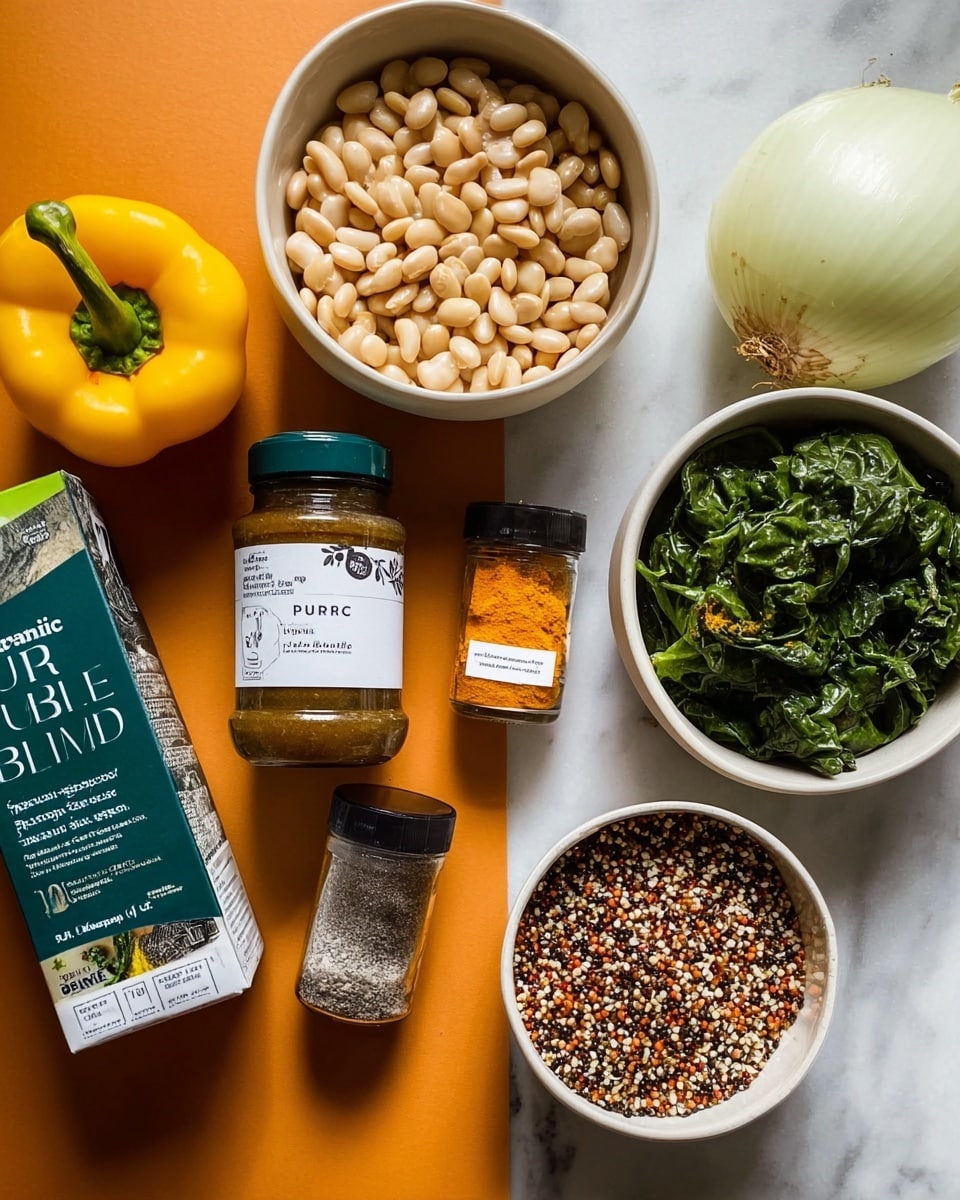 The image shows a flat layout of cooking ingredients on a white marbled surface. In the top left corner, there is a white bowl filled with pale beige beans. To its right, another white bowl holds a large white onion and a bright yellow bell pepper. Below these bowls, there is a carton of organic vegetable broth on the left, and next to it are two spice jars: one labeled