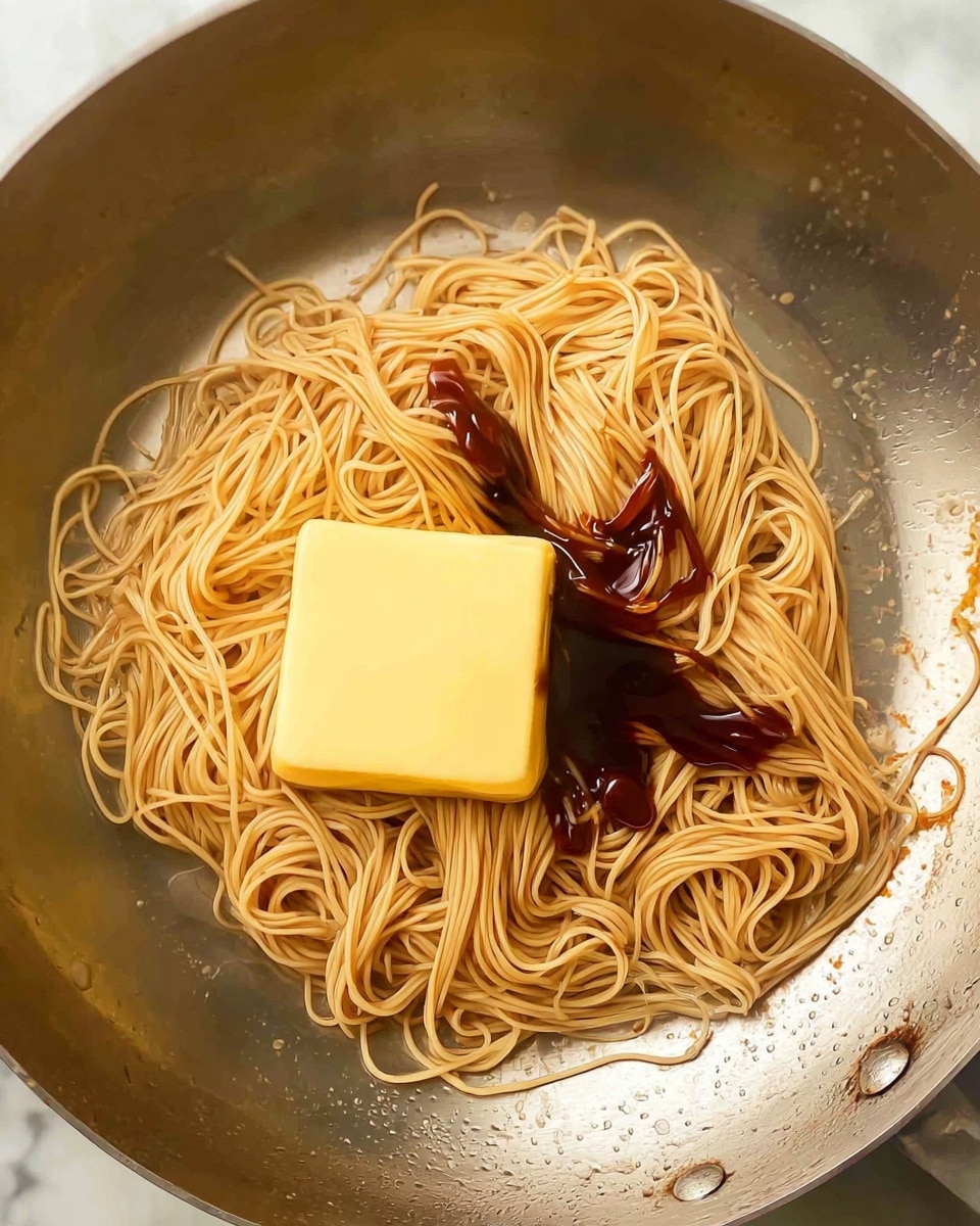 A close-up image shows pieces of cooked brown meat with slightly charred edges in a dark black wok, mixed with chunks of green and red bell peppers and white onion pieces, all being sprinkled with black pepper by a woman's hand holding a pepper mill above. The vegetables and meat pieces are roughly cut into medium-sized chunks, sitting together in the wok with visible steam rising. A golden ladle rests on the side of the wok, and the cooking surface underneath shows small white spots and a clean stovetop. The background is a white marbled texture photo taken with an iphone --ar 4:5 --v 7