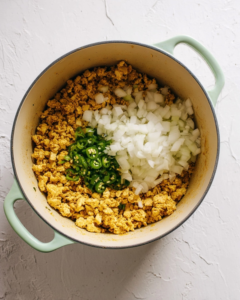 Two white plates each hold two stuffed bell pepper halves with a brown and slightly red filling topped with melted cheese and chopped green herbs and jalapeño slices. On the side of each plate are neatly arranged light green avocado slices and a sprig of fresh cilantro. The plates are on a white marbled surface with lime halves and fresh cilantro leaves scattered nearby. A striped cloth napkin and two black forks are placed at the bottom left corner. The photo taken with an iphone --ar 4:5 --v 7