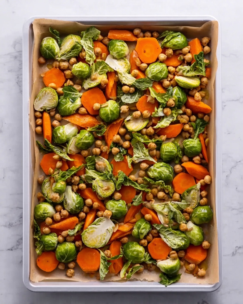 A white round bowl is held by two woman's hands on a white marbled surface, filled with a layered dish. The bottom layer is a smooth creamy white sauce spread evenly. On top, there is a mix of roasted vegetables including orange carrot chunks, golden-brown chickpeas, and charred green Brussels sprouts with crisp dark edges. Scattered over the vegetables are small pieces of green pistachios and finely chopped fresh green herbs. To the top left, a baking tray lined with parchment paper holds more roasted vegetables. A light gray cloth napkin is placed on the right side, next to matte gold-colored fork and spoon. Small bowls with chopped pistachios and herbs are seen nearby. Photo taken with an iphone --ar 4:5 --v 7