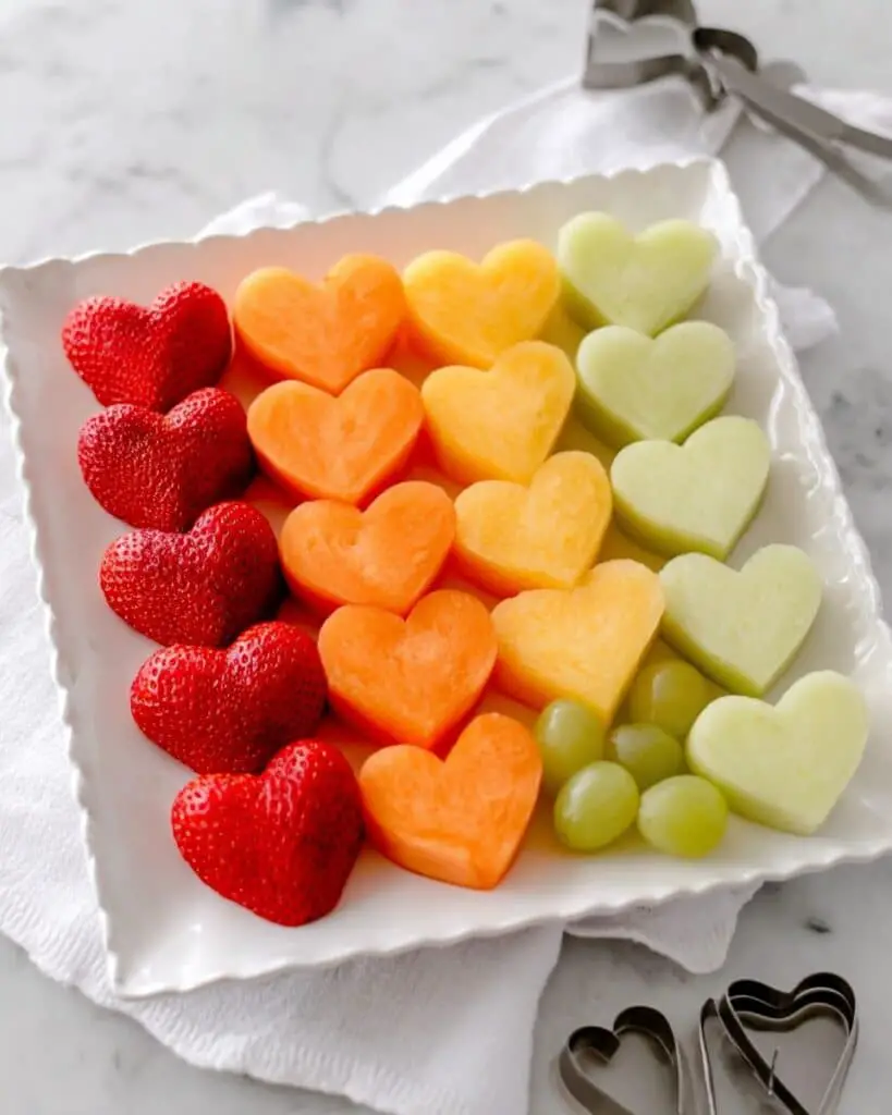 Colorful Heart Fruit Board with Strawberries, Melons, and Mangos Recipe