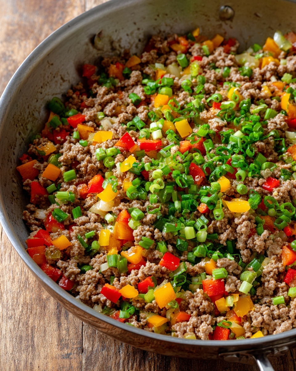 Inside a deep, silver-colored pan with a slightly scratched surface, there is one layer of raw ground meat placed slightly to the right side. The meat is light pink with a soft, textured look, showing long thin strands pressed together in a rectangular shape. The pan has some browned spots and a little oil underneath the meat, highlighting slight shininess on that side. The background remains out of focus but shows a natural wooden surface behind the pan. photo taken with an iphone --ar 4:5 --v 7