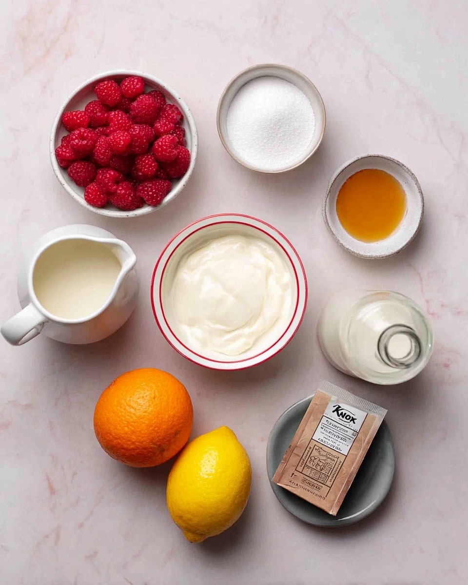 The image shows a collection of ingredients for a recipe, neatly arranged on a white marbled surface. Starting from the top left, there is a small white bowl filled with bright red raspberries, followed by a white bowl of fine white sugar. To the right, a small white bowl holds a light amber liquid, likely vanilla extract. Below, a white bowl with a red rim contains thick white yogurt or cream. A glass bottle with a metal cap is filled with a white liquid, possibly milk. On the bottom left, a white ceramic pitcher holds a creamy white liquid. Next to it, an empty small white bowl sits beside a ripe whole lemon and a fresh orange, both with textured skins. On the right side, a small grey dish holds a brown packet of Knox unflavored gelatin. The entire set-up is clean and bright, showcasing each ingredient clearly for a cooking or baking recipe photo taken with an iphone --ar 4:5 --v 7