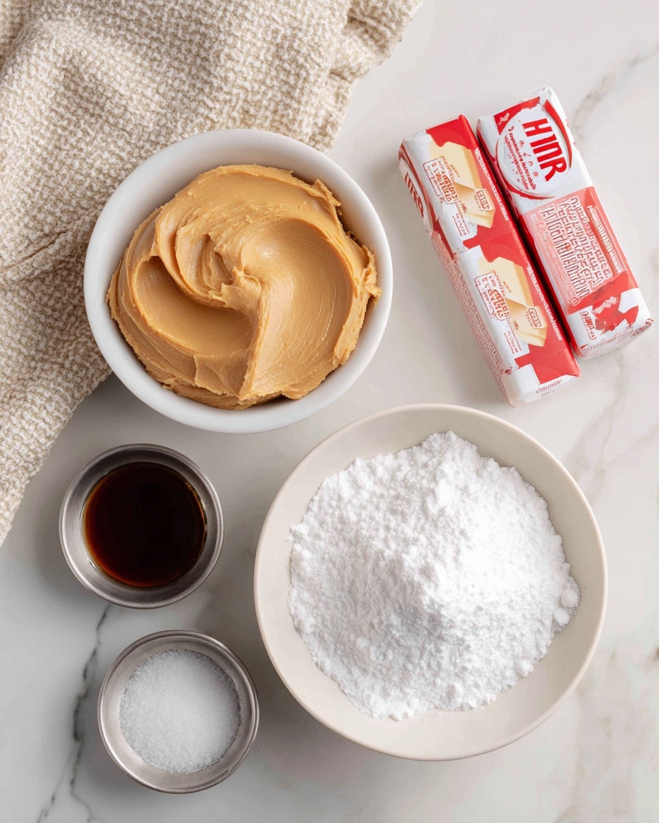 The image shows a white bowl filled with smooth, creamy light brown peanut butter placed near the center left. Below it, there is a white bowl heaped with fine white powdered sugar. To the right, two sticks of wrapped unsalted butter with red text lay side by side. Near the bottom left are two small silver metal bowls, one holding dark brown vanilla extract and the other containing a small amount of white salt. The items rest on a white marbled surface, and a beige and white textured cloth is partially visible at the top left corner. photo taken with an iphone --ar 4:5 --v 7