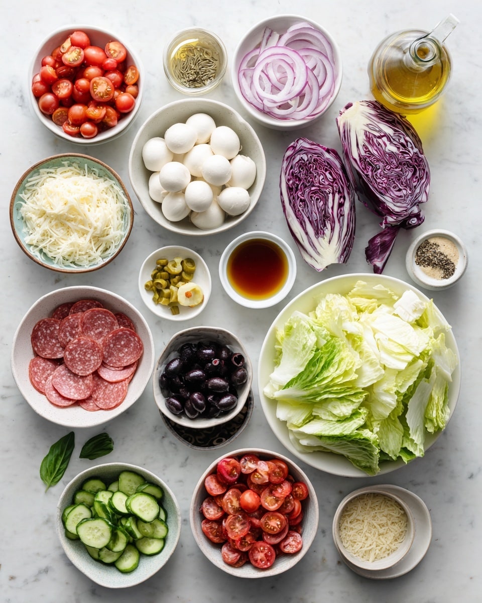 A large white bowl filled with a colorful layered salad sits on a white marbled surface. The base layer is a mix of light and dark green lettuce leaves with deep red radicchio scattered throughout. On top, there are halved bright red cherry tomatoes, round white mozzarella balls sprinkled with black pepper, and pale yellow chickpeas. Thin slices of light pink salami are spread evenly, along with sliced black olives and translucent rings of red onion. There are also chunks of light green cucumber and curved yellow pepper slices adding more color and texture. To the side, two small wooden bowls hold grated white cheese and fresh green basil leaves. Photo taken with an iphone --ar 4:5 --v 7