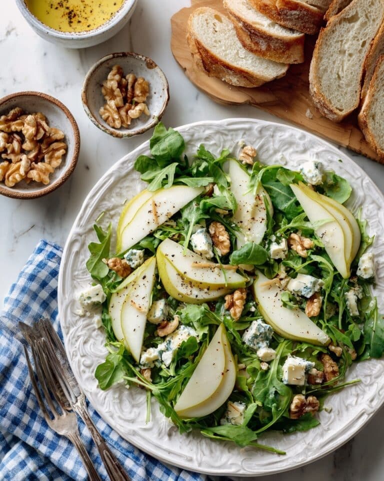 Arugula Pear Salad with Toasted Walnuts, Blue Cheese, and Honey Vinaigrette Recipe
