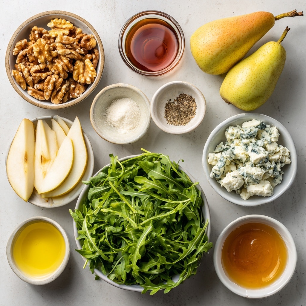 A white plate with a detailed pattern holds a fresh salad made of several layers: a base of bright green arugula leaves, topped with thin slices of pale yellow-green pear with the skin on, scattered chunks of white and blue-veined cheese, and small pieces of light brown walnut halves spread evenly. The salad is lightly seasoned with black pepper, all placed on a white marbled surface. Nearby, a wooden board has several slices of crusty white bread, and small bowls hold extra walnut pieces. A blue and white checkered cloth partly covers the surface. Photo taken with an iphone --ar 4:5 --v 7