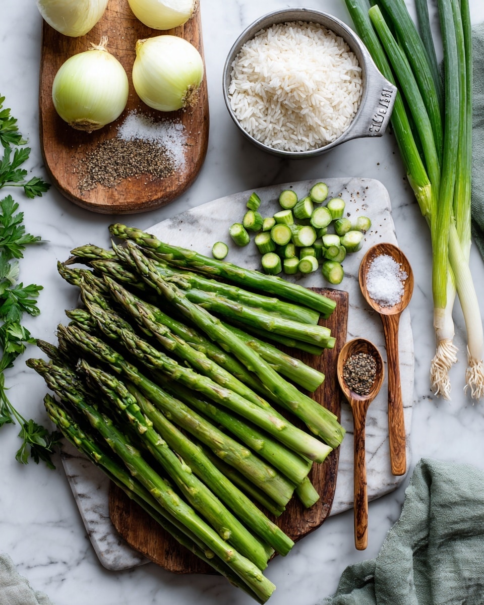 The image shows fresh green asparagus arranged in two layers on a white marbled surface, with one group whole and another group cut into small round pieces on a white marble cutting board layered over a wooden cutting board. There are two halved yellow onions, one finely chopped, placed on the top left wooden board. A metal measuring cup filled with white rice is positioned on the top right, next to two wooden spoons holding black pepper and coarse salt. To the right side, several green onions lie diagonally, and a green cloth is partially visible in the top right corner. Some parsley leaves are peeking from the bottom left corner. Photo taken with an iphone --ar 4:5 --v 7