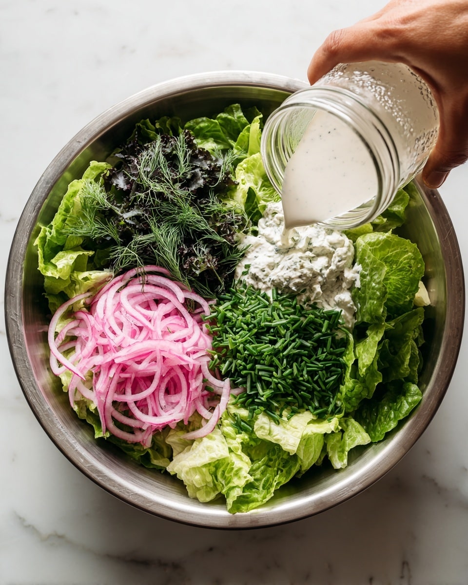 A bowl holds a fresh green salad made of several layers: at the bottom, light and dark green lettuce leaves create a mix of soft and crinkled textures. Scattered on top are thin rings of pale pink onion adding a slight contrast. Bright green chopped chives and delicate sprigs of dill sit gently over the leaves, giving the salad a fresh and vibrant look. The bowl is white with a slight rough texture, and the scene is set on a white marbled surface. Photo taken with an iphone --ar 4:5 --v 7