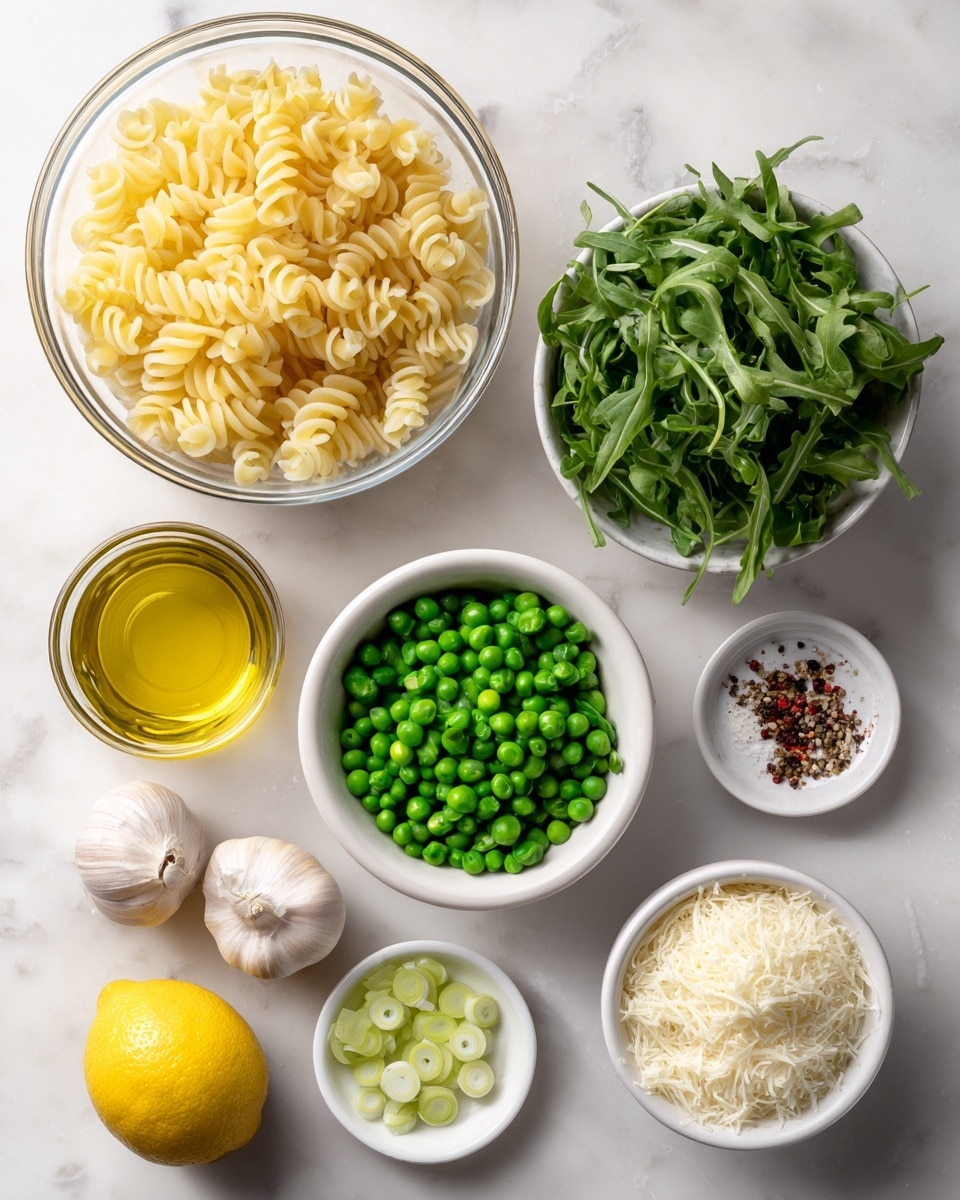 The image shows a top view of separate ingredients arranged neatly on a white marbled surface. Starting from the top left, there is a large clear glass bowl filled with light yellow, twisted spiral pasta. To the right, a white bowl contains fresh green arugula leaves. Below the arugula, a white bowl is filled with bright green peas. Moving downward, there is a glass with a golden liquid, likely olive oil, placed in the middle. To the bottom right, a white bowl holds finely grated white cheese. To the bottom left, a white bowl contains finely sliced green onions. Above this, two whole garlic cloves and a whole yellow lemon rest side by side, with a small white bowl holding mixed spices including red flakes and black pepper placed nearby. The composition is clean and bright, with each ingredient clearly visible and separated. Photo taken with an iphone --ar 4:5 --v 7