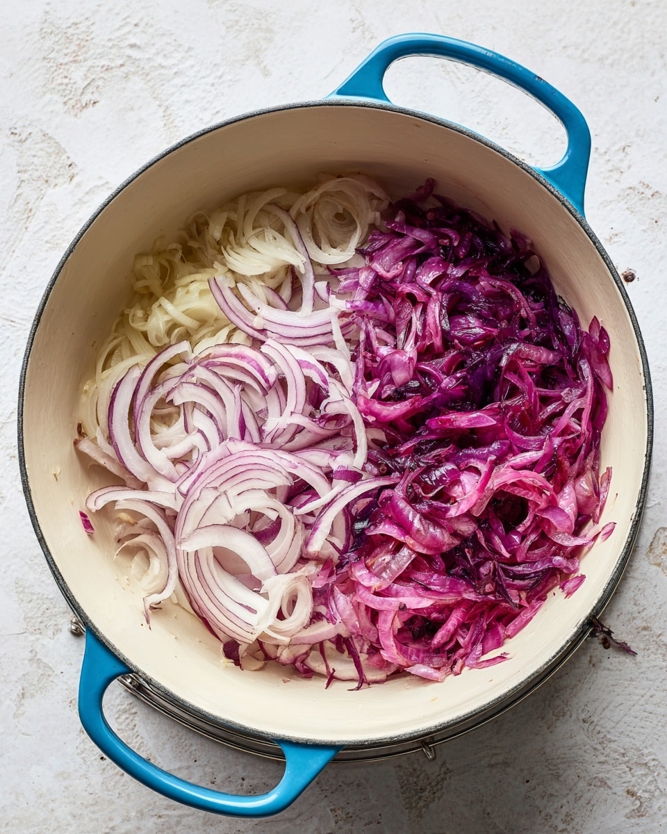 A white bowl filled with a thick orange sauce, with large soft orange cubes of sweet potato mostly submerged inside. Dark green wilted spinach leaves are mixed evenly throughout the bowl. The sauce looks creamy, speckled with black pepper and red chili flakes. A silver spoon is standing inside the bowl on the right side. The bowl rests on a white marbled surface with some scattered herbs nearby. photo taken with an iphone --ar 4:5 --v 7