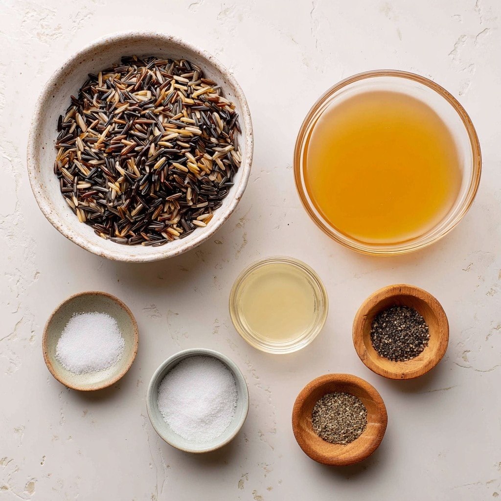 A close-up top view of cooked mixed brown and red rice filling a black cooking pot with a black handle and a shiny silver utensil behind it, all placed on a white marbled texture surface. The rice shows small grains with a glossy and slightly sticky texture in shades of light brown and reddish hues, layered evenly inside the pot, giving a warm and hearty look. Photo taken with an iphone --ar 4:5 --v 7