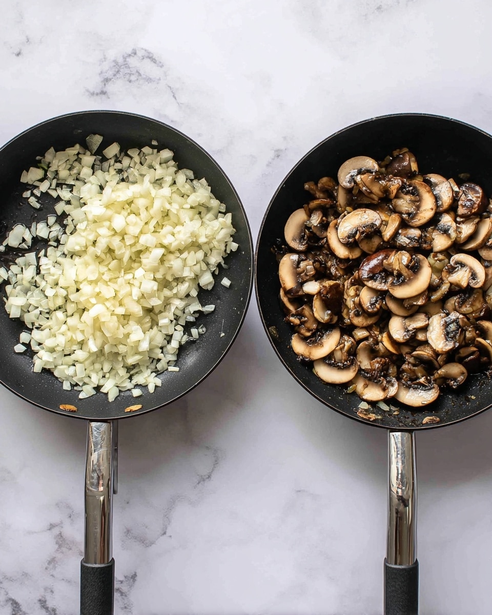 In the image, there are two black frying pans placed side by side on a white marbled surface. The pan on the left shows a single layer of finely chopped small white onions sautéing, with a glossy and slightly translucent texture spread evenly across the pan's bottom. The pan on the right contains a layer of mixed whole and sliced brown and white mushrooms, with a glossy, cooked look and slight browning, densely filling the pan. Both pans show a few bits of cooked onion scattered around, with the black pan surface visible between the ingredients. photo taken with an iphone --ar 4:5 --v 7