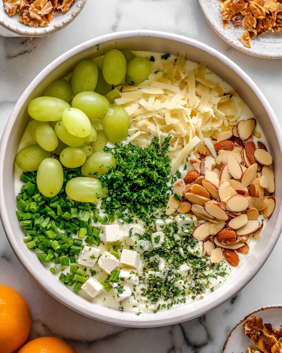 A close-up image of a tall sandwich made with three layers of soft brown whole grain bread. Between the layers are visible pieces of white chicken meat mixed with green leafy lettuce and a creamy dressing with herbs. The sandwich sits on a wooden surface with a softly blurred background. The texture of the bread looks crusty on the edges and soft inside, while the filling shows a mix of smooth and leafy textures. Photo taken with an iphone --ar 4:5 --v 7