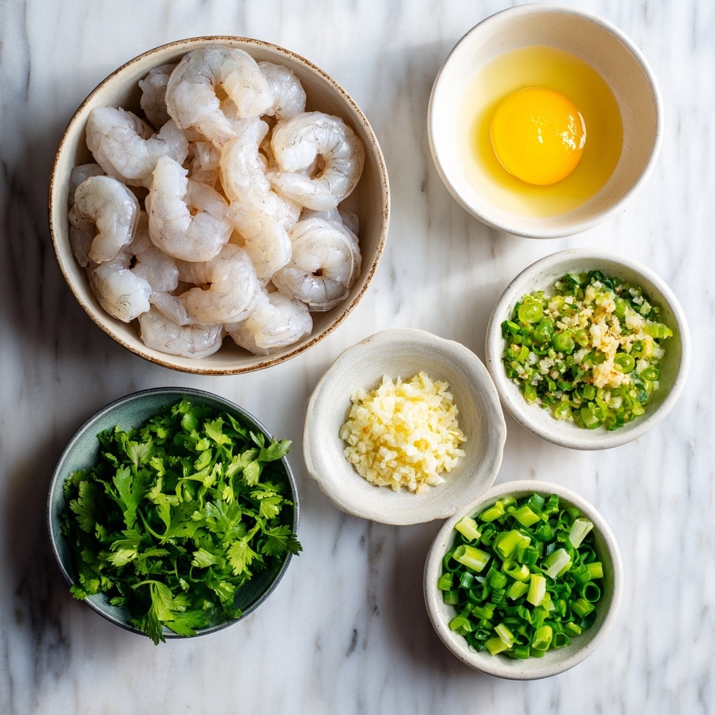 A clear glass bowl sits on a white marbled surface, filled with a mixed, chunky green and beige paste-like mixture that has visible small bits of herbs and vegetables throughout. A white spoon rests inside the bowl, partially submerged in the mixture, with the handle extending out toward the bottom right of the frame. The texture of the mixture looks soft but slightly coarse, with a mix of finely chopped green herbs and creamy beige ingredients. photo taken with an iphone --ar 4:5 --v 7