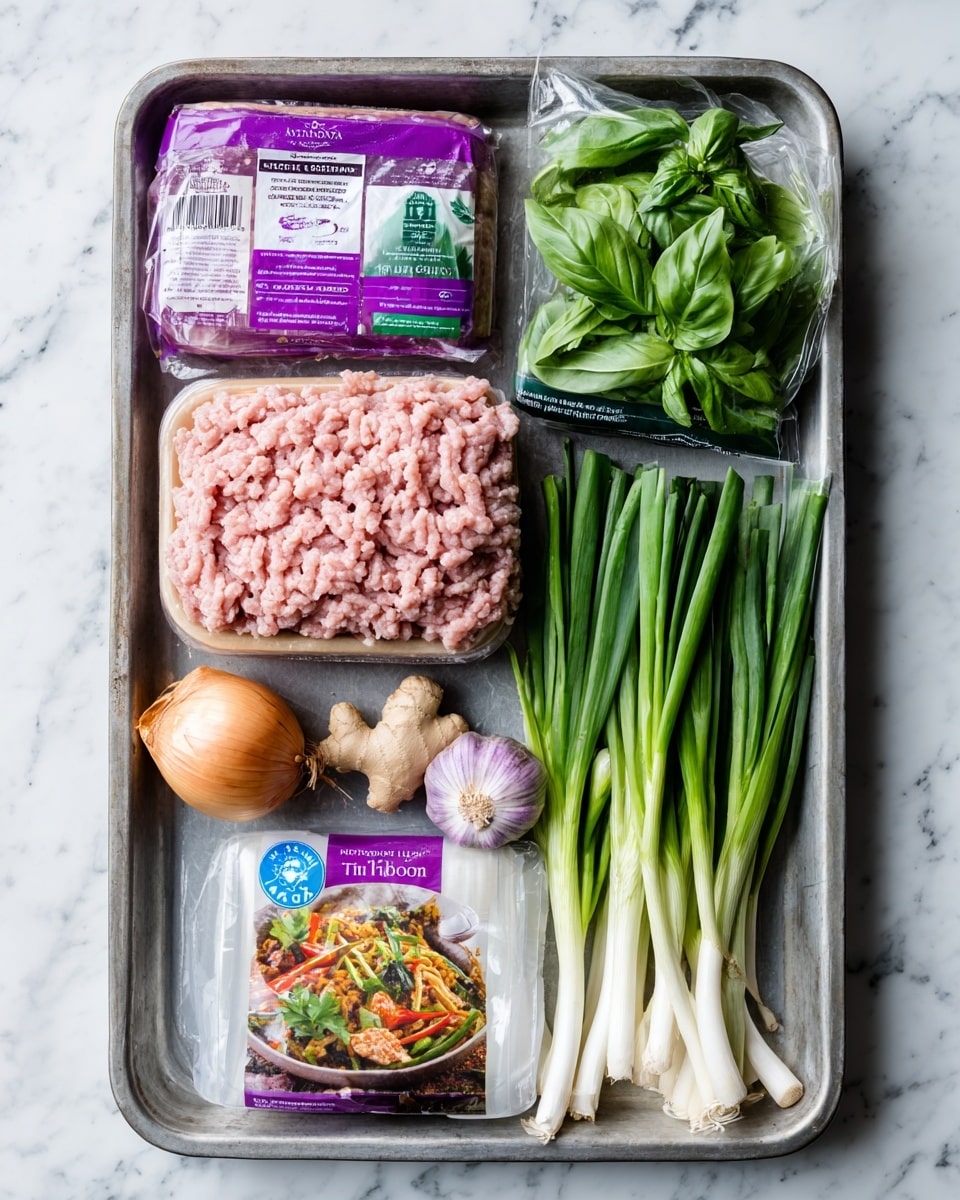 A metal tray on a white marbled texture holds various fresh ingredients: a large pack of pink British lean turkey mince with a purple label at the top left, next to a bag of bright green basil leaves with a black and green label at the top right; below them, a clear pack of light brown ginger with a blue sticker on it sits to the left, a whole golden brown onion and a cluster of three purple-tinted garlic cloves are near the center, and a bunch of long, white and green spring onions extends from the right edge inward; at the bottom right, a white plastic packet with a purple label contains fresh green coriander, and at the bottom left is a box of Thai red curry kit featuring a colorful image of curry in a bowl. photo taken with an iphone --ar 4:5 --v 7