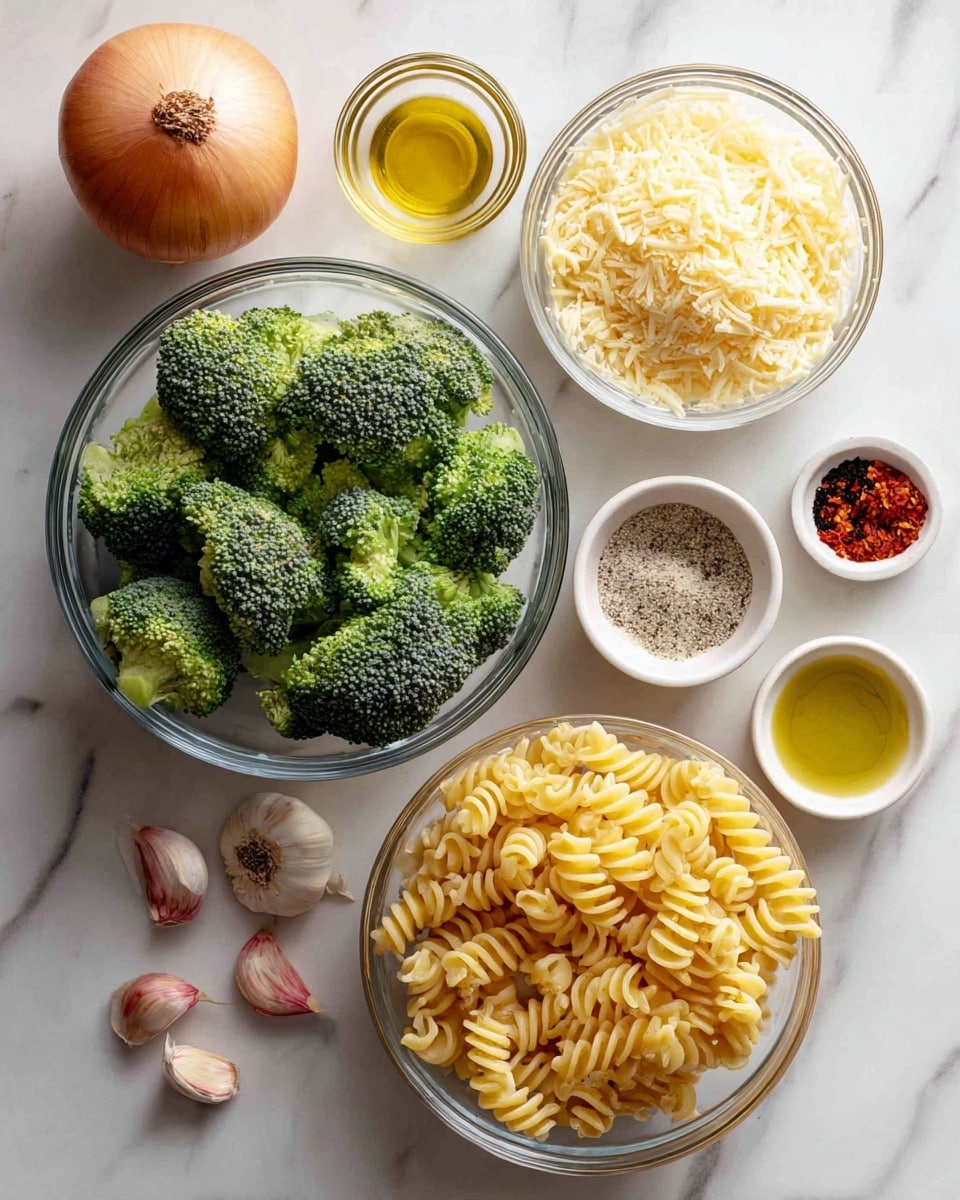 Several clear glass bowls on a white marbled surface hold different ingredients: a large bowl filled with bright green broccoli florets at the bottom; a medium bowl on the right side with golden-yellow rotini pasta; a smaller bowl with pale yellow shredded cheese placed above the pasta; a small bowl containing fine beige breadcrumbs next to the cheese; a tiny bowl with red chili flakes above the breadcrumbs; an equally small bowl with olive oil to the left of the chili flakes; and a small bowl with a mix of salt and black pepper to the top right of the pasta bowl. A whole light brown onion sits on the top left of the image, and three peeled garlic cloves with a pinkish tint are scattered near the pasta bowl. Photo taken with an iphone --ar 4:5 --v 7
