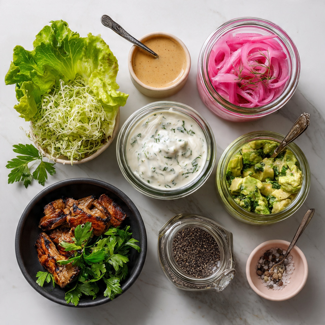 The image shows a close-up view of fresh green leafy vegetables on a wooden surface with a white marbled texture background. On the left, there is a large pile of thinly sliced dark green leafy lettuce, layered with slightly lighter green shredded lettuce on top. To the right of the greens are chunky pale green avocado slices placed in a white bowl with a curved edge. Toward the background, another white bowl holds bright yellow lemon wedges along with green cucumber pieces and fresh leafy herbs. The textures of the vegetables range from smooth avocado flesh to crinkly leafy greens, creating a fresh and natural composition. Photo taken with an iphone --ar 4:5 --v 7