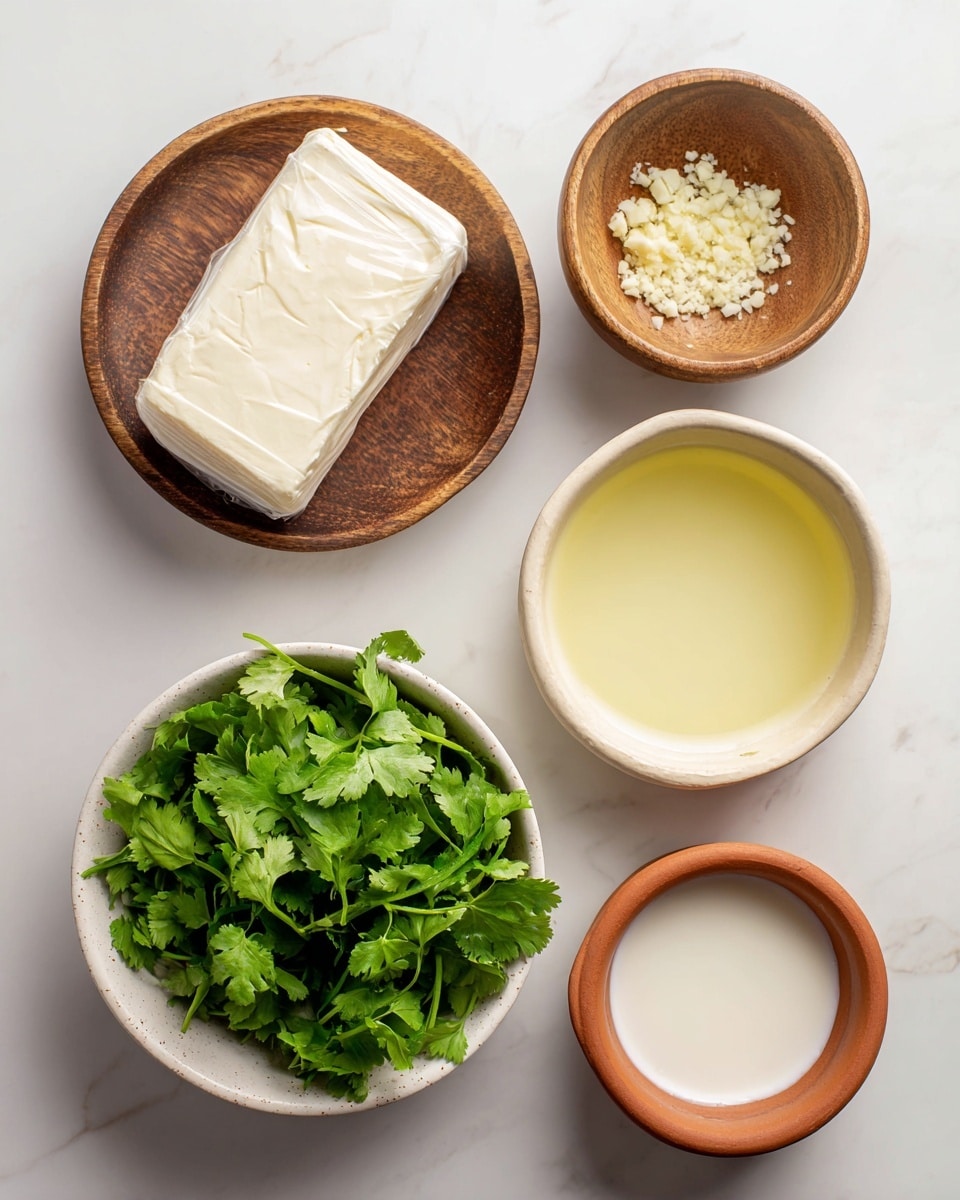 The image shows five items arranged on a white marbled surface: a wrapped block of cream cheese at the top, a small wooden bowl with chopped garlic and salt to the left, a white bowl filled with fresh green cilantro leaves to the right, a pale yellow bowl containing a light yellow liquid below the wooden bowl, and a small terracotta bowl with a white creamy liquid below the white bowl of cilantro. All the items are neatly spaced and clearly visible. photo taken with an iphone --ar 4:5 --v 7