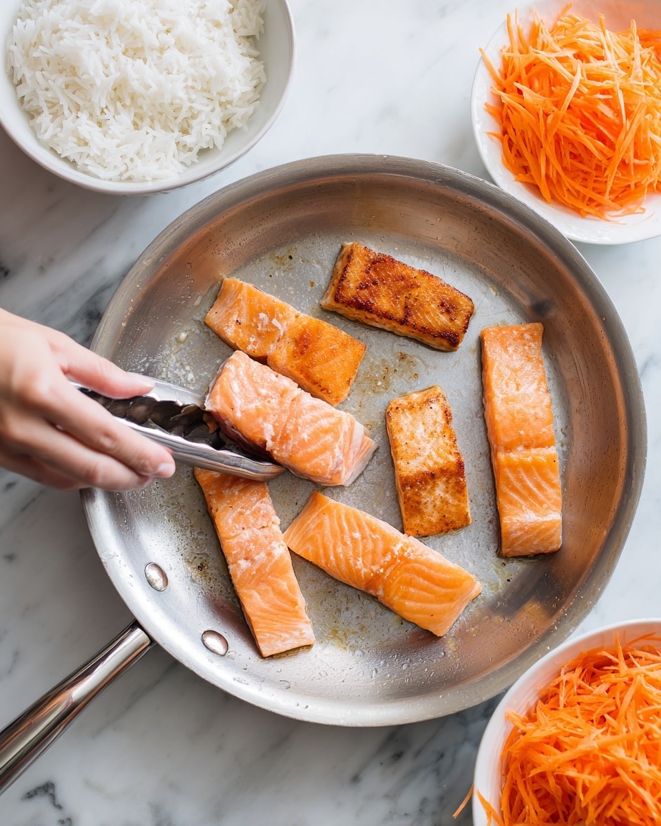 A white bowl contains a layered dish starting with a base of white rice at the bottom left, followed by bright orange shredded carrots placed on the top left side. Next to the carrots, on the right, is a portion of light purple and white shredded cabbage. On top of the rice and veggies are several golden brown cooked chunks of salmon arranged center top, drizzled with a light pink creamy sauce and sprinkled with sesame seeds. Next to the salmon, on the right side, are smooth slices of light green avocado also sprinkled with sesame seeds. On the bottom left over the rice are diced cucumber pieces in bright green shades. A silver fork rests diagonally inside the bowl on the left side. The bowl is set on a white marbled surface with small bowls of shredded carrots, diced cucumbers, and a light pink sauce jarred nearby. Photo taken with an iphone --ar 4:5 --v 7