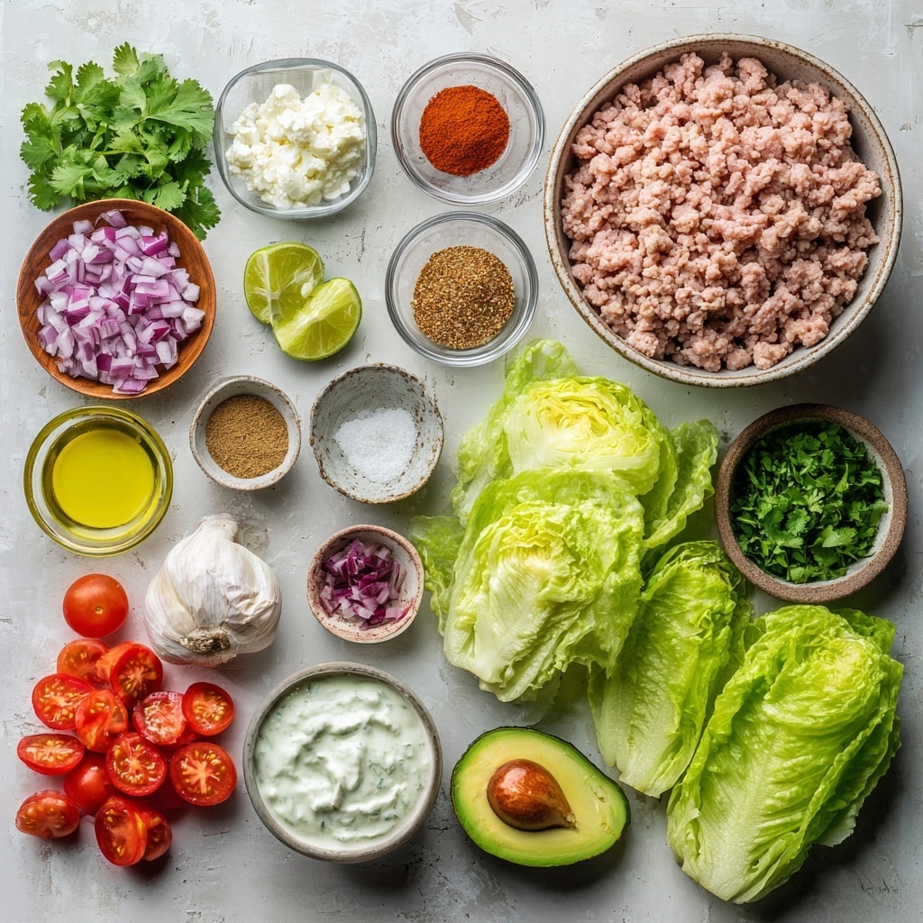 A top-down view of a clear food processor bowl filled with layers of ingredients: bright green fresh cilantro leaves, a clove of white garlic, white yogurt, golden brown spices, and white salt, all arranged around the black center blade. Next to it is a close-up side view of a white pan filled with cooked ground meat mixture showing a warm brown color with small bits of green herbs and diced onions mixed in, stirred by a wooden spoon that rests inside the pan. Both images have a white marbled surface underneath, photo taken with an iphone --ar 4:5 --v 7
