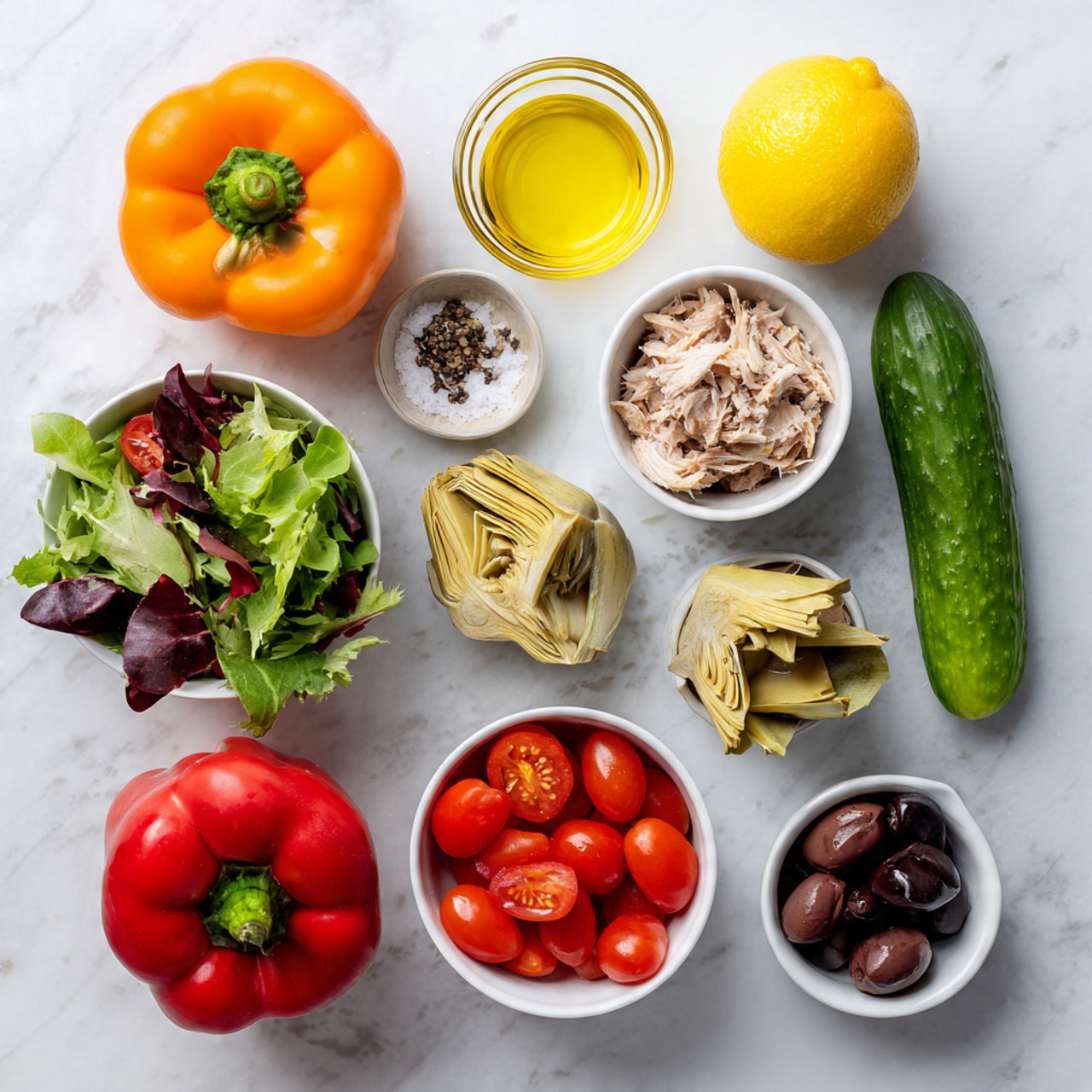 The image shows a flat lay of fresh salad ingredients placed on a white marbled surface. There are two whole bell peppers, one orange on the left and one red near the top center. To the right of these, a whole lemon and a whole cucumber are placed. At the center, a small glass bowl holds a light yellow oil, next to a smaller glass bowl with salt and pepper. Below these, a white bowl contains quartered artichoke hearts with a slightly yellow and green texture. To the left, a white bowl is filled with fresh mixed green leaves with red veins. At the bottom, a white bowl holds bright red cherry tomatoes, and next to it, a small clear glass bowl holds dark purple olives. Near the top center, an open can shows light beige shredded tuna. The colors are bright and fresh with a clean layout. Photo taken with an iphone --ar 4:5 --v 7