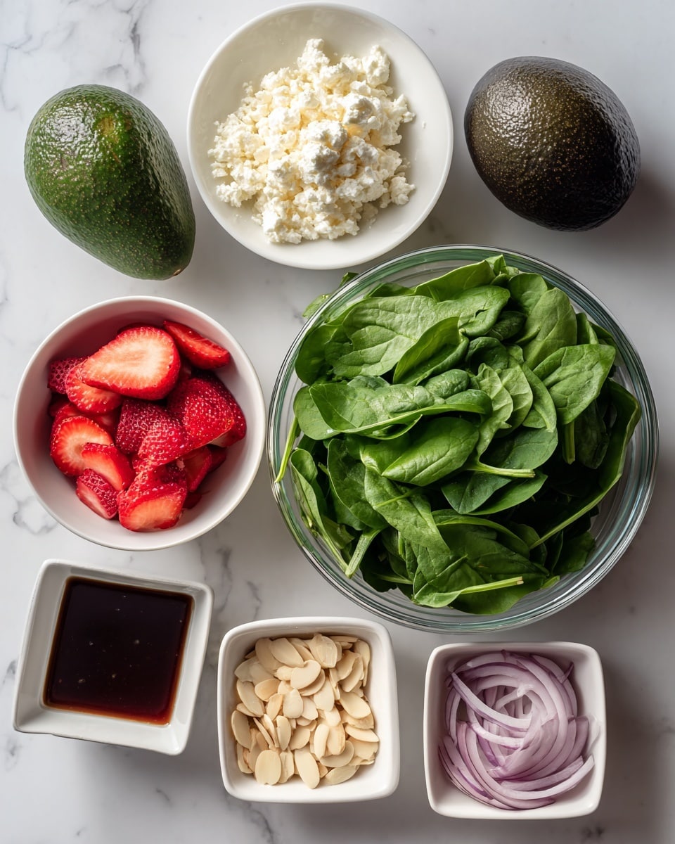 The image shows six bowls and one avocado arranged on a white marbled surface. At the center right is a large clear bowl filled with fresh green spinach leaves with smooth textures. Above this bowl is a small white plate piled with creamy white crumbled cheese. To the left of the cheese is a whole dark green avocado with rough skin. Below the avocado is a medium white bowl filled with bright red sliced strawberries, each slice showing juicy textures. Below the large clear bowl is a small white bowl with beige sliced almonds, flat and thin. To the right of the almonds is a small white bowl containing thinly sliced light purple onions shaped in curved strips. At the bottom left is a small white square bowl filled with a dark brown salad dressing with shiny surface. Photo taken with an iphone --ar 4:5 --v 7