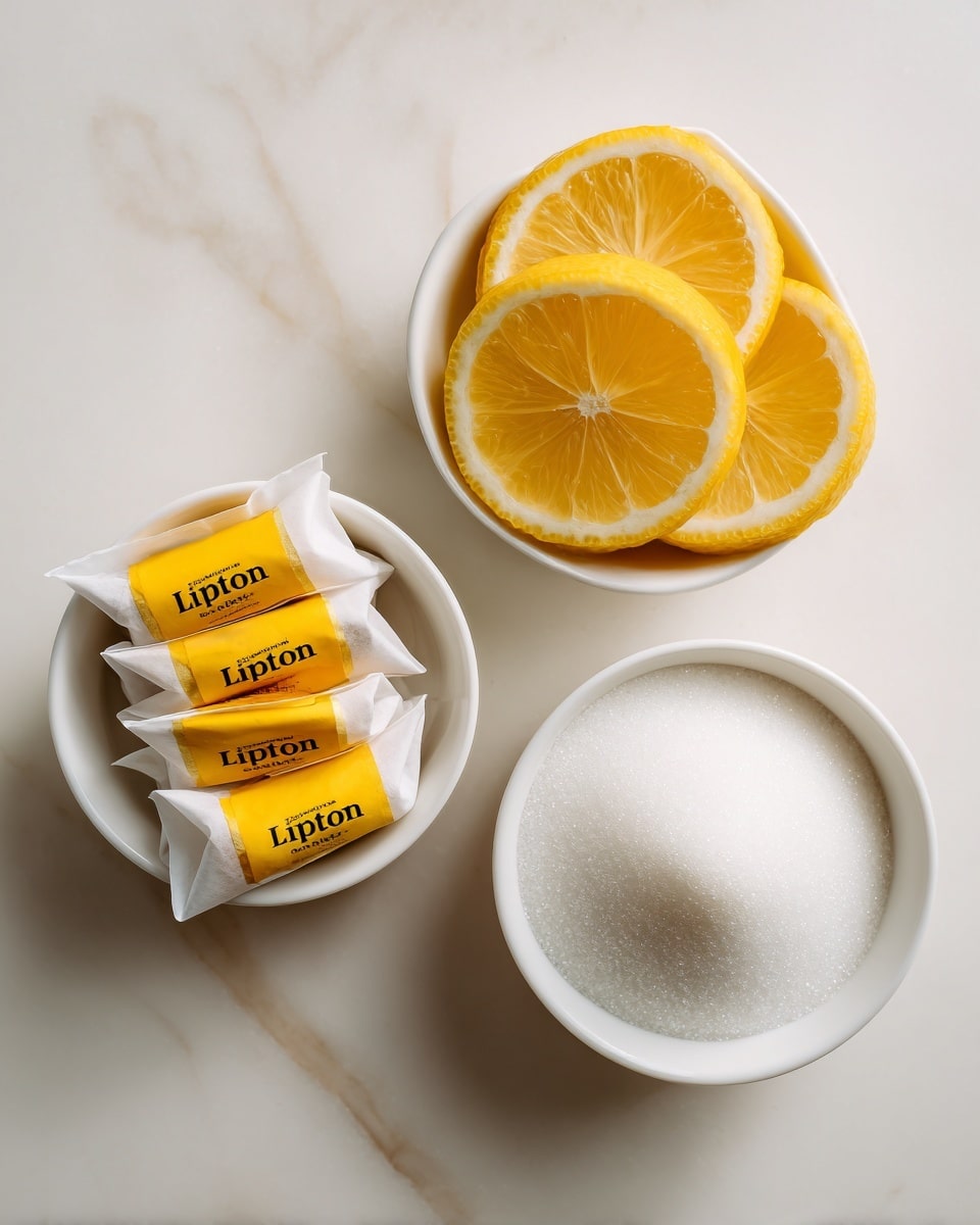 The image shows three small white bowls placed on a white marbled surface. The left bowl holds five tea bags with yellow tags labeled