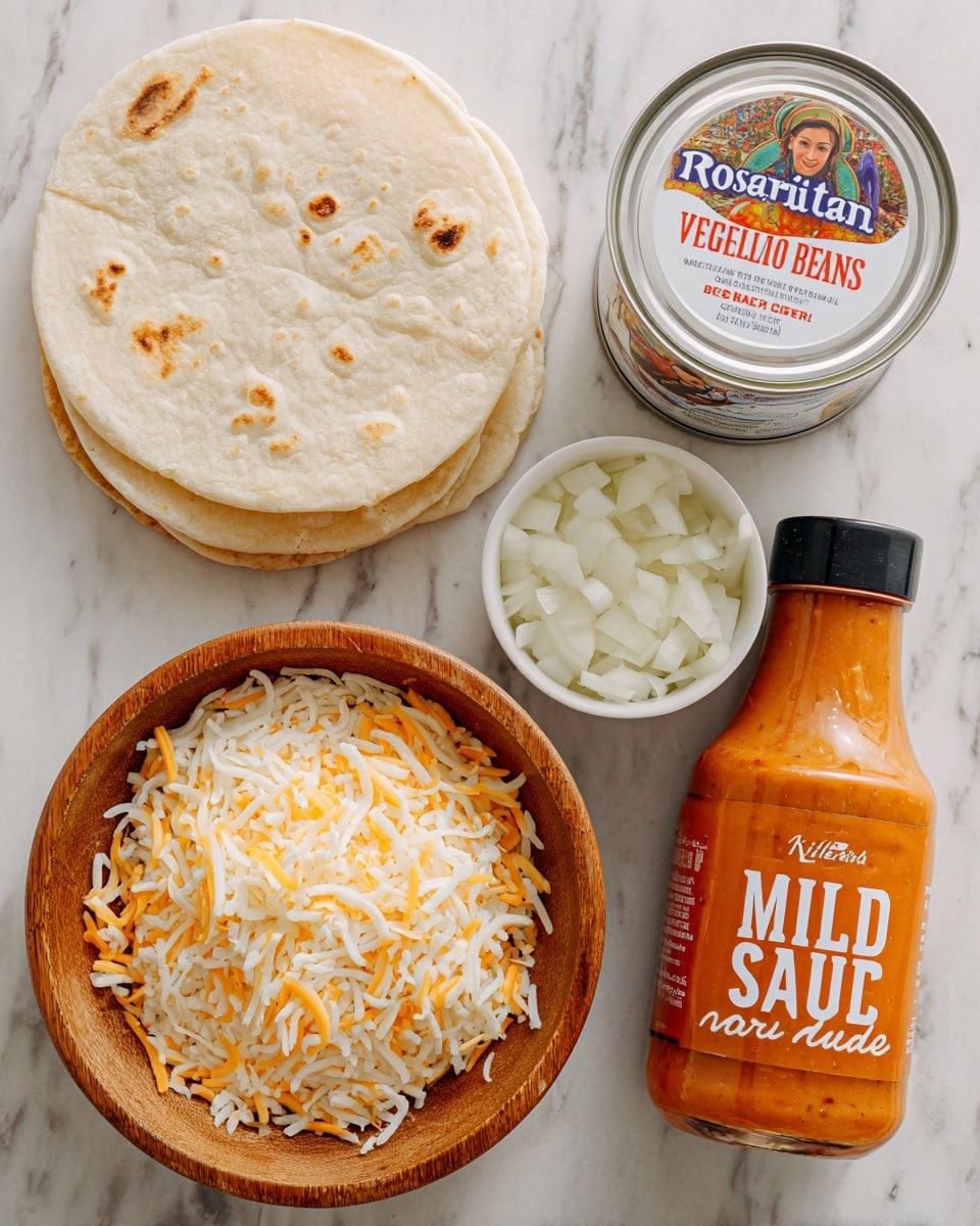 The image shows five separate food items arranged on a white marbled surface. On the left, there is a small stack of light beige tortillas with faint brown spots on them. In the middle, a round wooden bowl is filled with shredded cheese that is a mix of white and orange-yellow strands, giving a soft, stringy texture. Next to it, a small white bowl holds chopped white onions with a crisp and fresh appearance. Above the cheese and onions, a silver can labeled