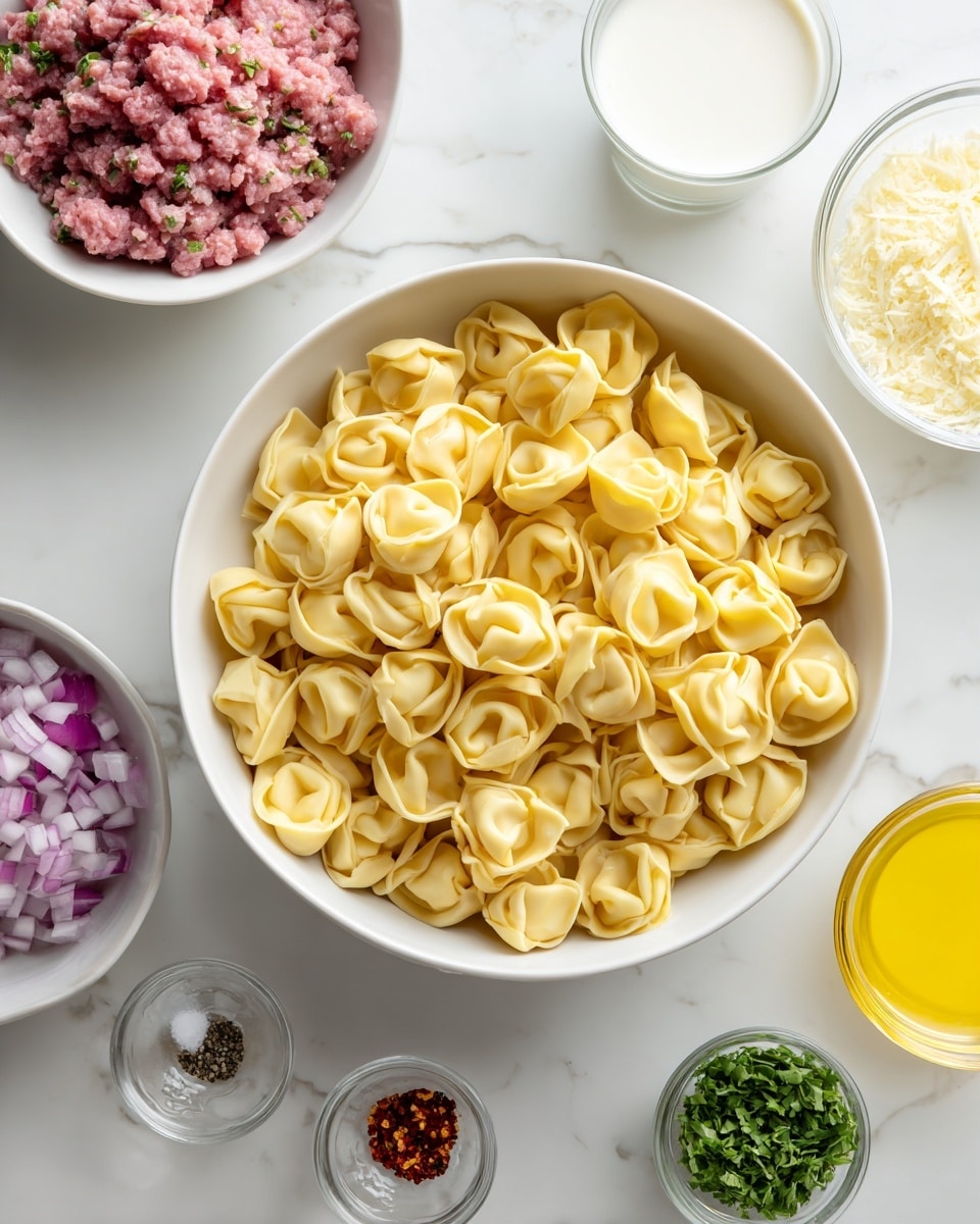 A white bowl filled with uncooked yellow tortellini pasta sits in the center on a white marbled surface. Surrounding it are smaller white bowls: one with a chunky mix of raw minced meat with some red and pink shades, another with finely grated pale cheese, a third with chopped purple onions, and another with small green leaves of herbs. There is also a clear glass with white creamy liquid, a small glass with bright yellow liquid, another tiny bowl with crushed yellow garlic, one small bowl with red pepper flakes, and a tiny bowl with white salt and black pepper. The whole setting is neat and arranged in a circular shape around the tortellini bowl, creating a clean and simple look photo taken with an iphone --ar 4:5 --v 7