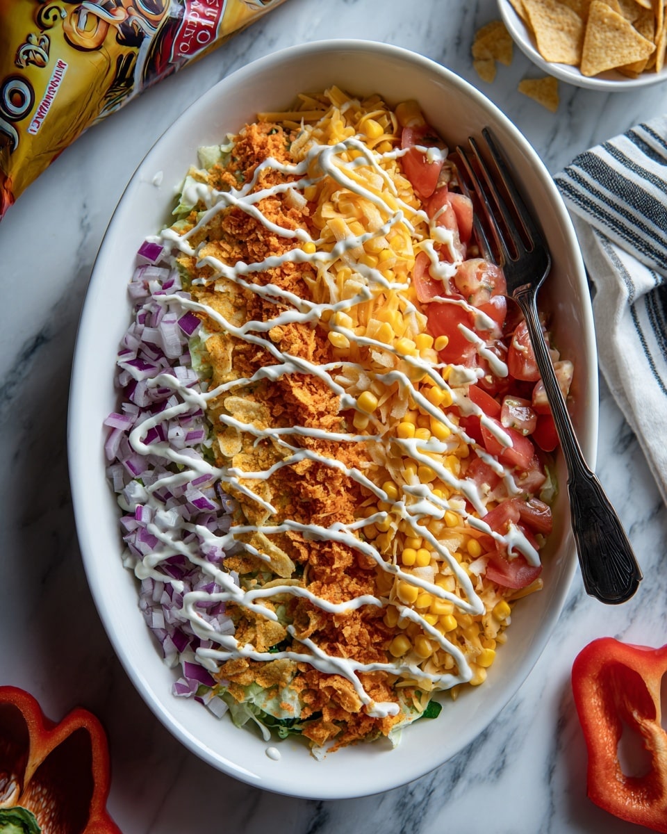 A white oval dish holds a colorful layered salad arranged in neat vertical stripes. From left to right, the first layer is finely chopped purple onions, followed by small diced red tomatoes. Next is a layer of crushed orange flavored corn chips, then yellow corn kernels, and finally shredded yellow cheese. The whole dish is drizzled with thin white lines of creamy dressing crossing all layers. A dark fork rests on top across the dish. The background is a white marbled texture with a sliced red bell pepper on the bottom right and a bag of flavored corn chips in the top left corner. Photo taken with an iphone --ar 4:5 --v 7