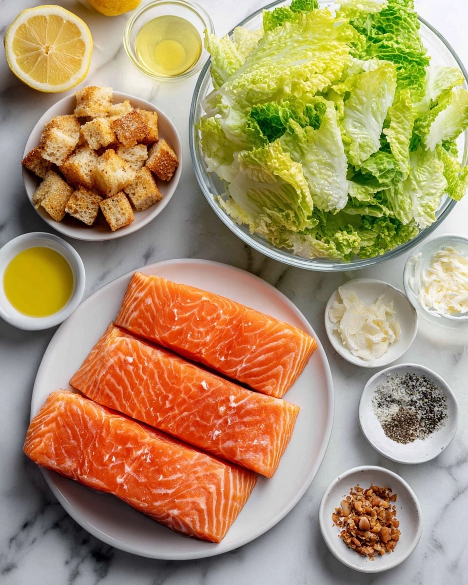 A white plate holds three bright orange raw salmon fillets with visible lines and texture on the flesh, placed on the lower right side. Above the salmon, there is a small white bowl filled with golden croutons that are rough and crunchy-looking. A large clear glass bowl at the top center is filled with chopped green lettuce with light and dark leafy shades and a fresh texture. Around these main items are small clear and white bowls arranged neatly: one with mustard, one with lemon halves on a white dish, one with olive oil that looks smooth and yellow, and another with a light clear liquid. There are also small white dishes containing finely grated cheese, black pepper, a brown paste, and fresh minced garlic or ginger. All these items rest on a white marbled surface photo taken with an iphone --ar 4:5 --v 7