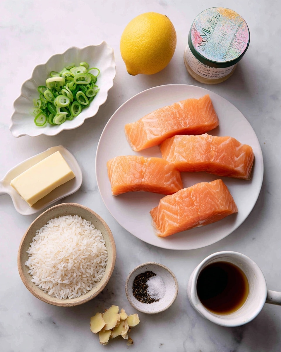 The image shows a collection of ingredients on a white marbled surface. In the center is a white plate holding four fresh, raw salmon fillets with a bright orange color and smooth texture, arranged neatly in two layers. Above the plate is a container of organic white miso paste with a colorful label. To the left of the plate is a small white dish shaped like a leaf, filled with thinly sliced green onions scattered around it. Below the plate is a light brown bowl filled with uncooked white rice grains. To the left of the rice is an unwrapped stick of butter with a creamy yellow color on silver foil. To the right of the plate are a whole lemon, a small white cup filled with brown liquid, and a small white dish containing a mix of black pepper and salt. Below these is a small piece of fresh ginger and a tiny bowl of pale yellow minced ginger. Photo taken with an iphone --ar 4:5 --v 7