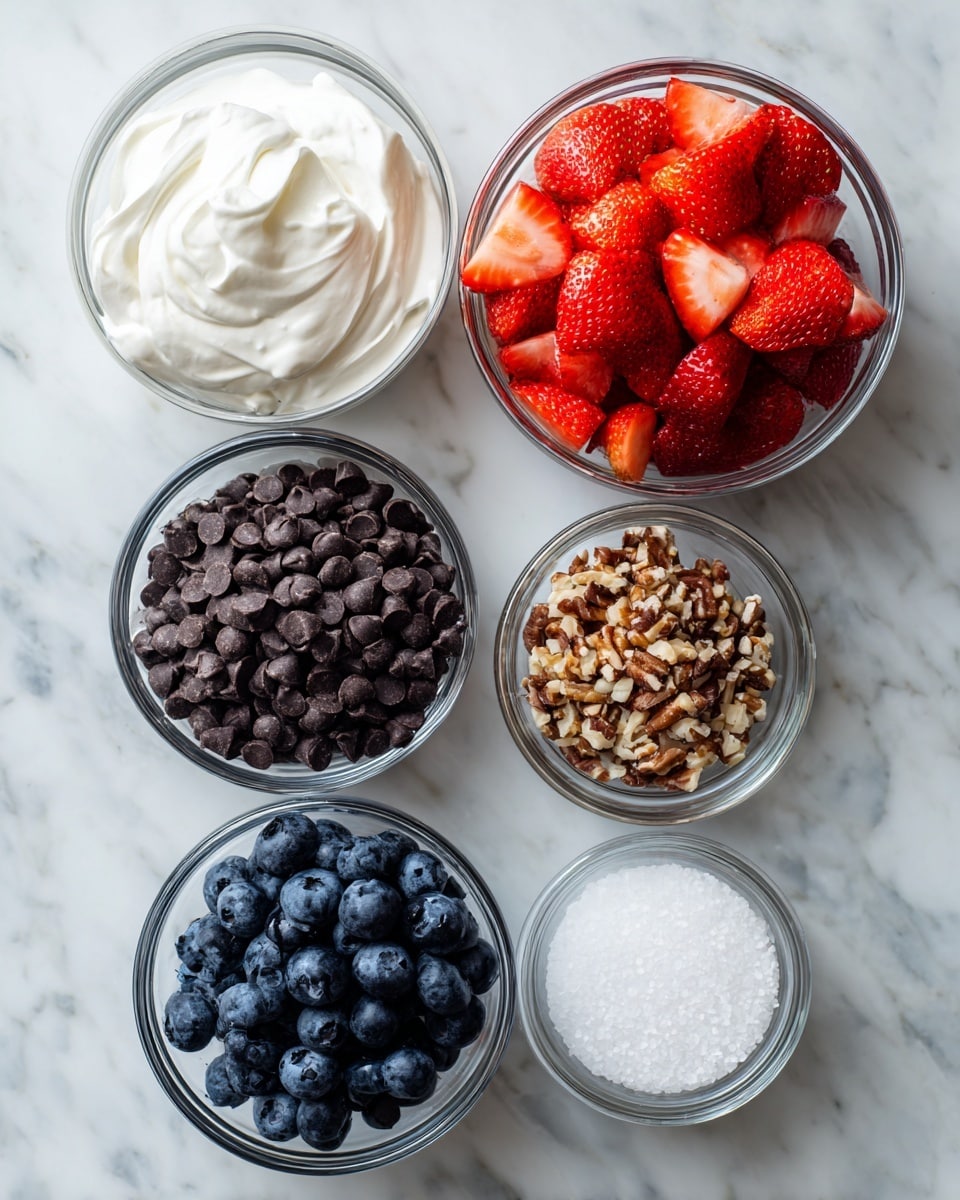 The image shows six glass bowls arranged on a white marbled surface. The top left bowl holds a thick and creamy white yogurt with a smooth but slightly lumpy texture. To its right, the largest bowl contains bright red, freshly chopped strawberries, cut into medium-sized pieces with a juicy texture. Below the yogurt is a bowl filled with dark chocolate chips, looking glossy and round, almost tightly packed. In the middle right is a very small bowl with crushed light brown nuts, adding a rough texture. At the bottom left is a bowl filled with dark blue, plump blueberries covered in a natural whitish bloom. Lastly, at the bottom right sits another tiny bowl containing coarse white salt crystals, giving a grainy look. Photo taken with an iphone --ar 4:5 --v 7