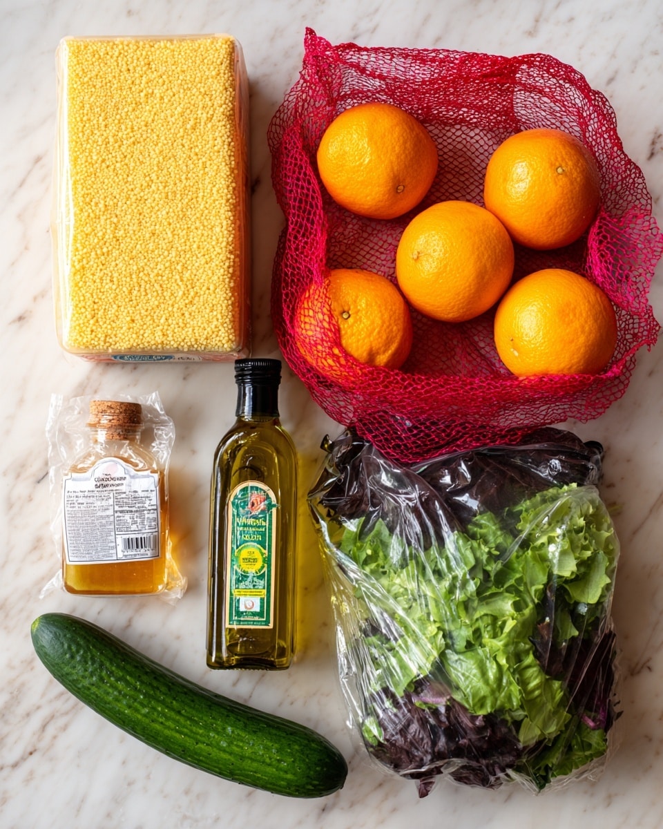 A collection of fresh ingredients is arranged on a white marbled surface, including a large yellow box of couscous, a red mesh bag filled with bright orange navel oranges, a small white packet of halloumi cheese, a clear plastic bottle of golden honey with a black cap, a tall transparent bottle of extra virgin olive oil with a green label, a long green cucumber with a sticker, and a plastic bag of mixed Italian style salad leaves that are dark green and leafy with purple accents. The items are neatly grouped together, showing a variety of textures like smooth citrus skin, leafy greens, and clear glass with liquid inside. photo taken with an iphone --ar 4:5 --v 7