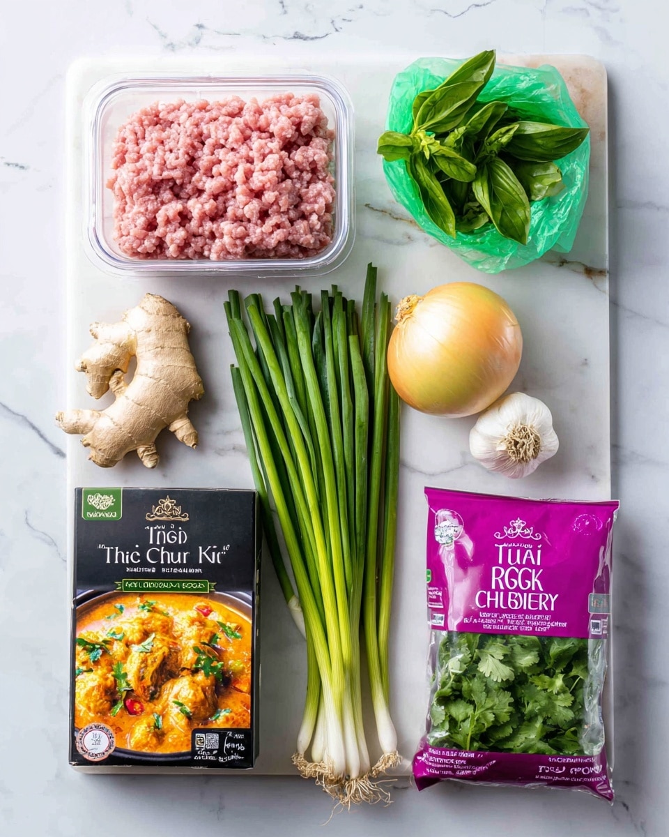 The image shows a tray with various cooking ingredients neatly arranged on a white marbled surface. In the top left corner, there is a clear plastic container of pink minced turkey meat. To the right of it, a small green plastic bag of fresh basil leaves sits upright. Below this, a yellow onion and a few peeled garlic cloves rest next to a bunch of long green spring onions aligned diagonally across the tray. Near the bottom left corner, there is a package of fresh ginger root next to a box labeled