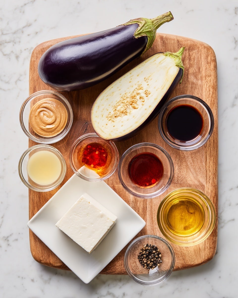 The image shows a white rectangular baking dish filled with roasted eggplant and tofu pieces. The eggplant is cut into long wedges, with a browned, slightly charred, and caramelized surface that is a mix of dark brown and golden hues. The tofu is cubed, also browned with crispy edges, and golden to light brown in color. Both eggplant and tofu are coated in a glossy sauce that gives them a slightly sticky texture. Small sesame seeds and chopped green onions are scattered over the dish, adding texture and a pop of green color. The baking dish rests on a white marbled surface, with a small white bowl partially visible at the top edge. Photo taken with an iphone --ar 4:5 --v 7