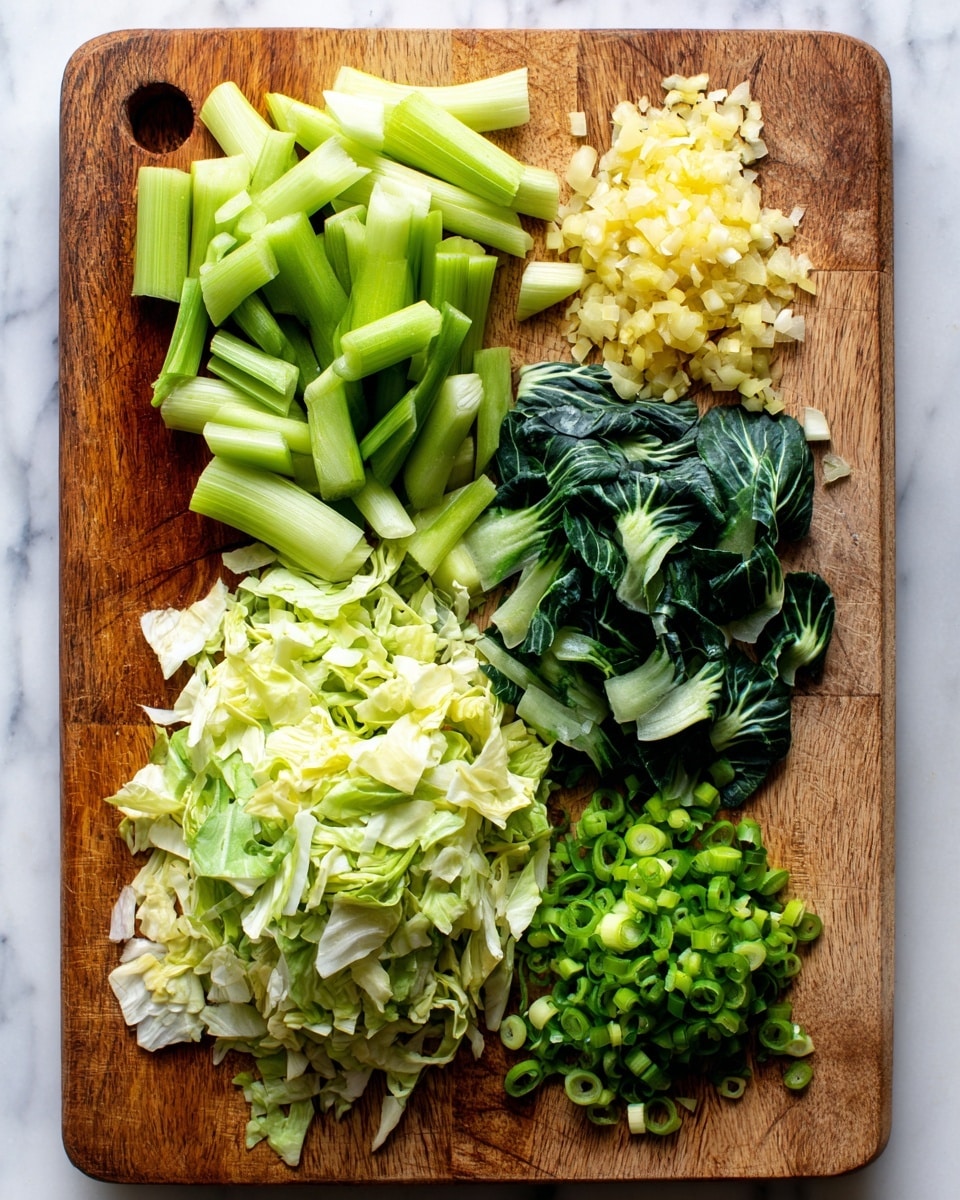 A wooden cutting board on a white marbled surface holds five groups of chopped vegetables arranged neatly. On the left, pale green celery pieces are curved and fresh-looking. Next to them are dark green leafy bok choy chunks with a crisp texture. In the middle, there is a pile of thinly shredded cabbage in light green and white colors. Toward the top right, small diced pieces of pale yellow garlic are gathered in a small heap. Below the garlic, finely sliced bright green scallions are placed in a small mound. Photo taken with an iphone --ar 4:5 --v 7