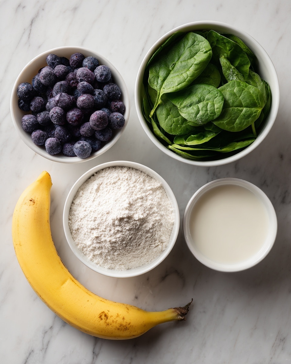The image shows four small white bowls and a banana arranged on a white marbled surface. The top left bowl holds dark purple frozen blueberries with a slight frost on them. The top right bowl contains fresh green spinach leaves filling the bowl. Below the blueberries is a small white bowl filled with white flour that has a soft, powdery texture. To the right of the flour is a small white bowl filled with a creamy white liquid, likely milk. The banana is bright yellow with a small brown spot near the top and is placed diagonally across the bottom left corner. photo taken with an iphone --ar 4:5 --v 7