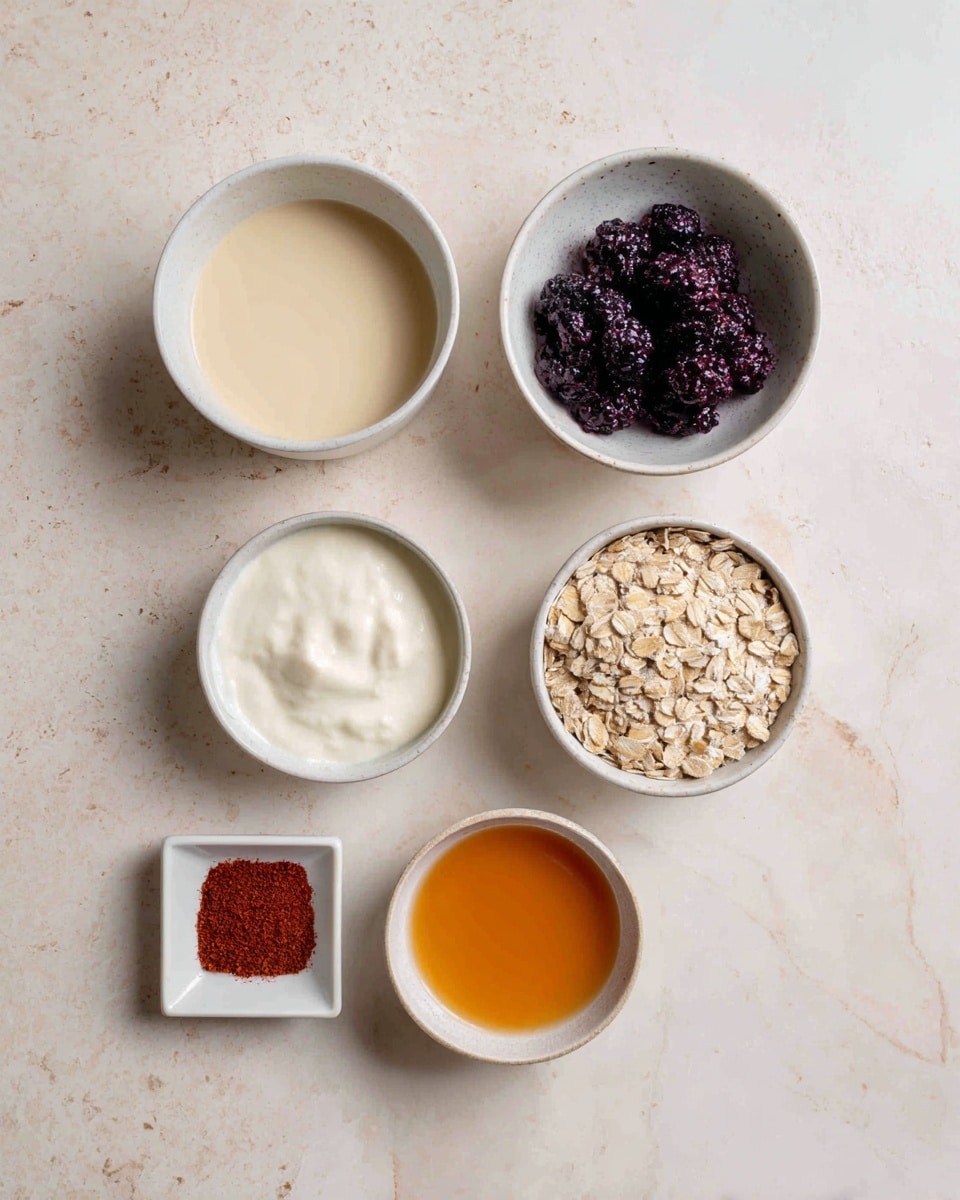 The image shows six small white bowls arranged on a white marbled surface. The top left bowl contains a smooth, cream-colored liquid. To the right of it, there is a bowl filled with dark purple and black berries. Below the cream liquid bowl is another bowl with a thick white substance that looks like yogurt. To its right, there is a bowl filled with light brown oats. At the bottom left, a small square white dish holds a small amount of reddish spice powder, and next to it on the right is a small round white bowl with an orange liquid. The overall arrangement is neat and the colors vary from creamy white to dark purple, brown, and orange. photo taken with an iphone --ar 4:5 --v 7