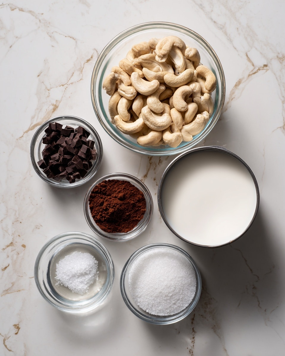 The image shows six clear glass bowls arranged on a white marbled surface. The largest bowl at the back center is filled with light beige cashew nuts soaking in clear water. To its right, there is an open white can of thick white coconut cream. In front of the cashews and coconut cream, there are four smaller bowls: one contains dark brown cocoa powder mixed with white powder and salt, another bowl holds small dark brown chocolate chips, a third bowl is filled with white granulated sugar, and the smallest bowl at the back left appears empty or contains a small amount of clear liquid. Photo taken with an iphone --ar 4:5 --v 7