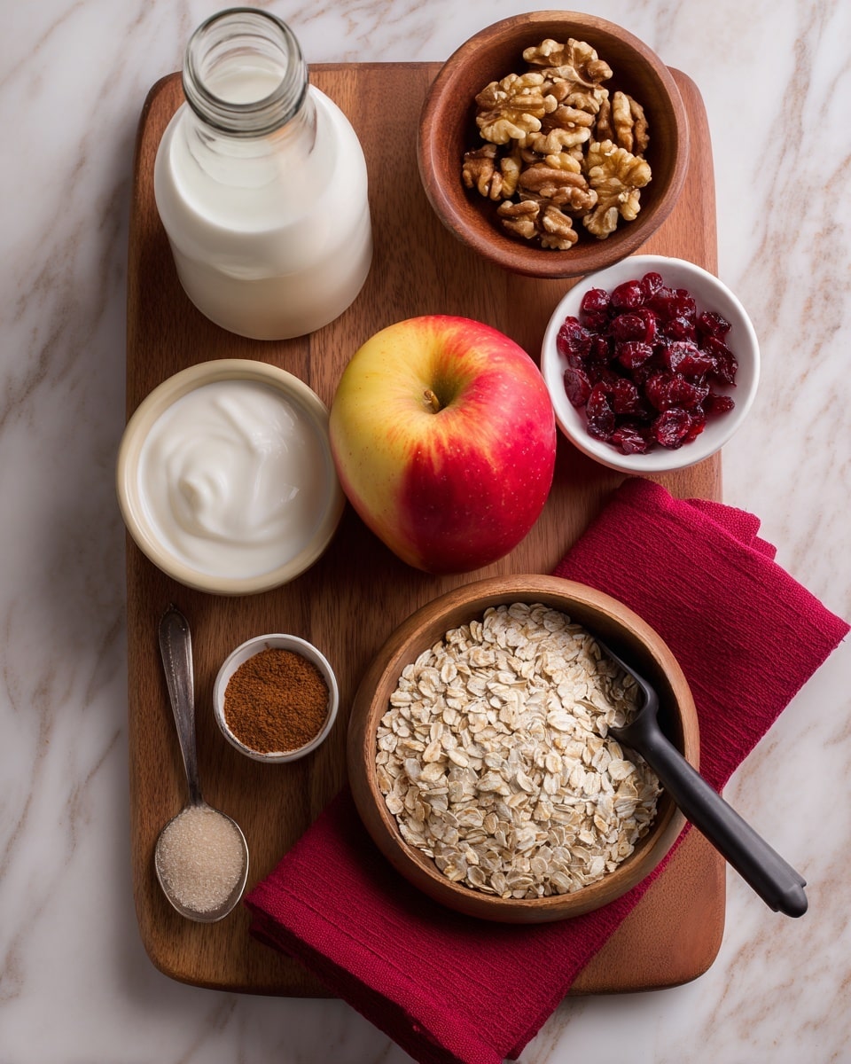 A wooden board with a large red and yellow apple in the center, surrounded by ingredients for making oatmeal. On the upper right of the board is a white bowl filled with walnuts. Next to it, a wooden bowl holds light-colored rolled oats with a black scoop inside, placed over a red cloth. Above the oats, a small white bowl is filled with dried red cranberries. To the left side of the board, a beige bowl contains thick white yogurt, and behind that is a clear glass bottle with milk. A small metal spoon with brown sugar rests near the apple. A small glass jar of ground cinnamon is on the left side of the board. The whole setup is on a white marbled surface photo taken with an iphone --ar 4:5 --v 7