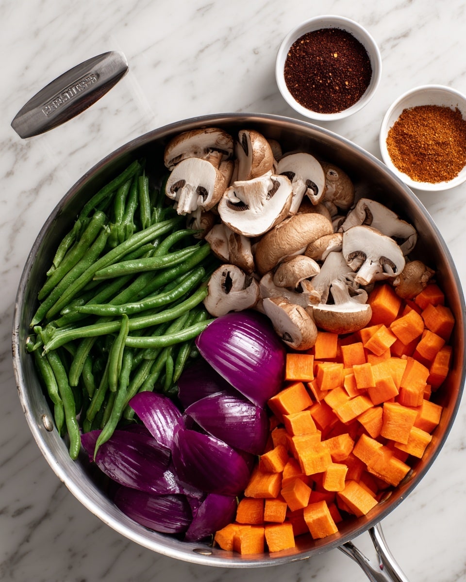 A stainless steel pan sitting on a white marbled surface holds four visible layers of fresh vegetables arranged in sections. Starting from the left, there are whole small green beans with a rough texture, followed by light brown mushroom slices with a smooth, slightly curved surface. Next to these are thick, shiny purple onion wedges with white inner layers, and finally, bright orange carrot cubes with a slightly rough texture on the right side. In the top right corner of the image, two small white bowls contain dark red and brown powdered spices. photo taken with an iphone --ar 4:5 --v 7